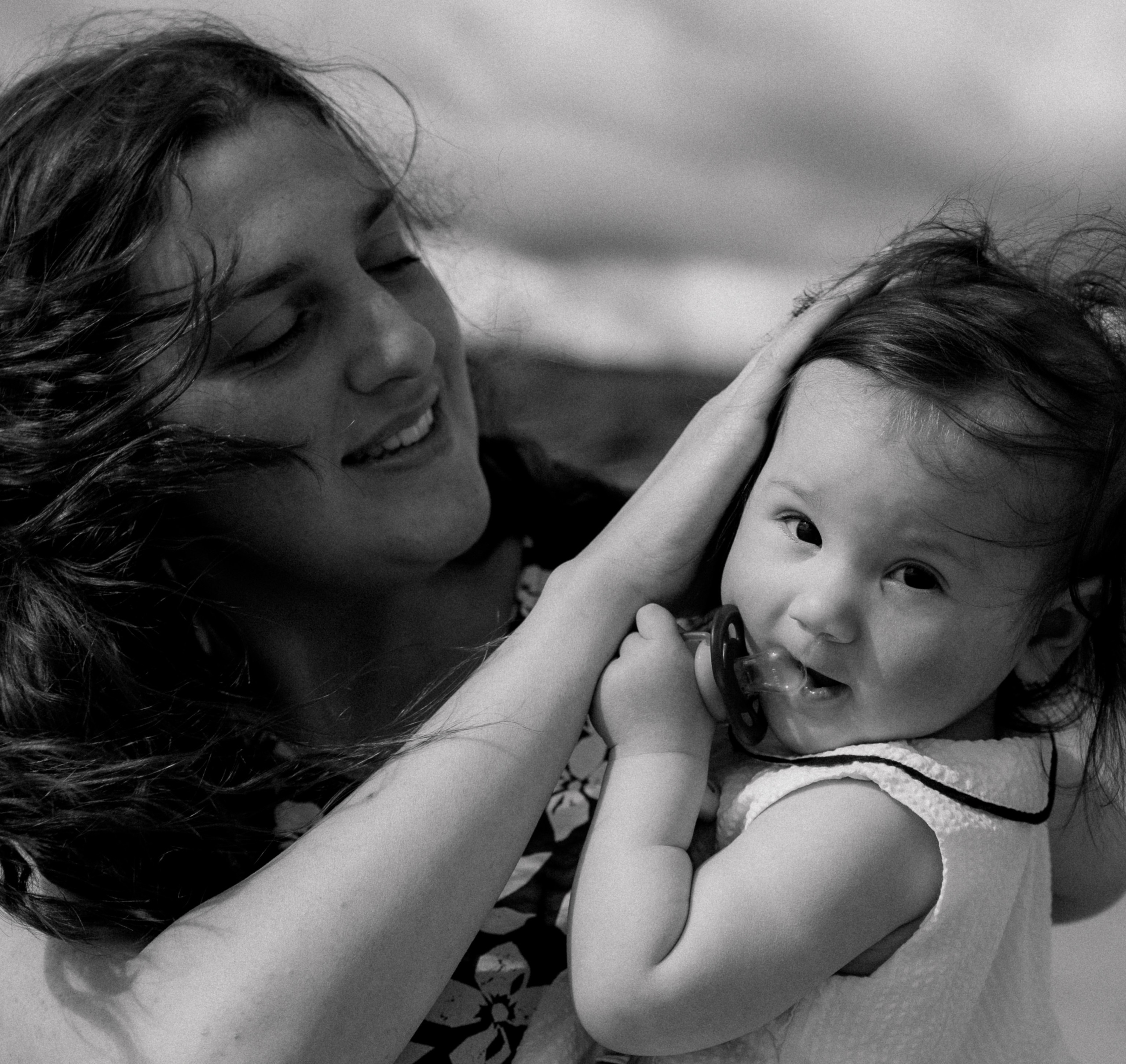 Darya and Mia at the ocean. Wedding and family photographer Ireland