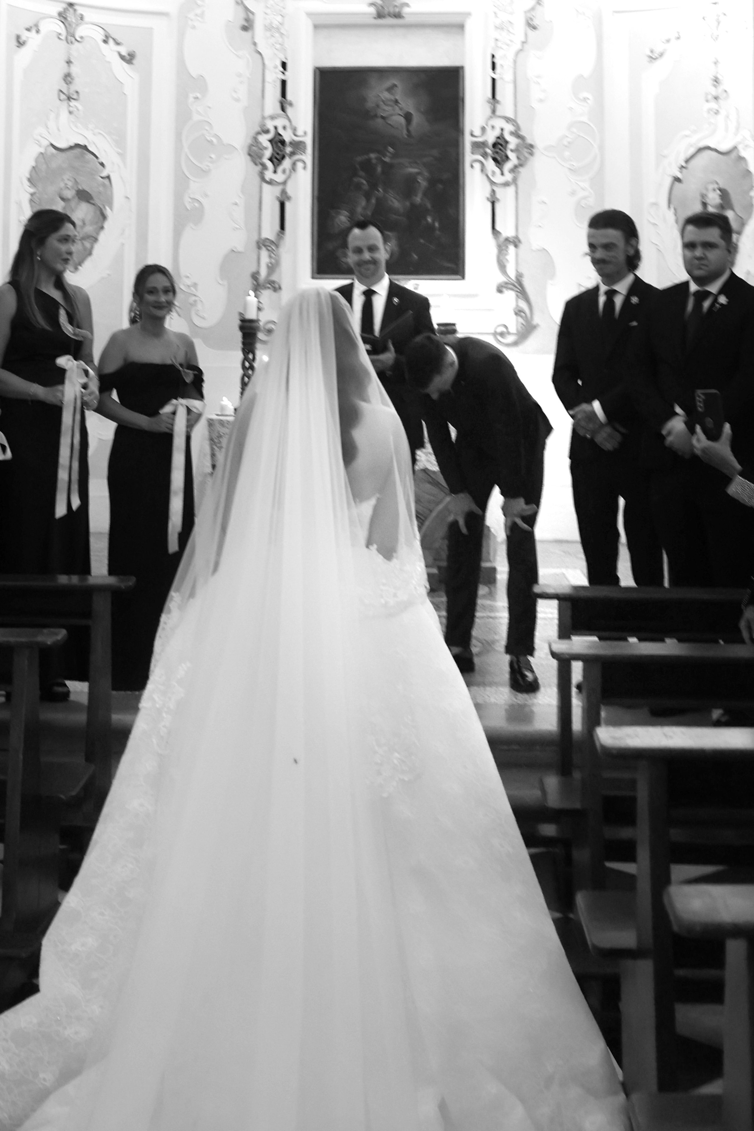 Romantic wedding ceremony inside a historic Italian church.