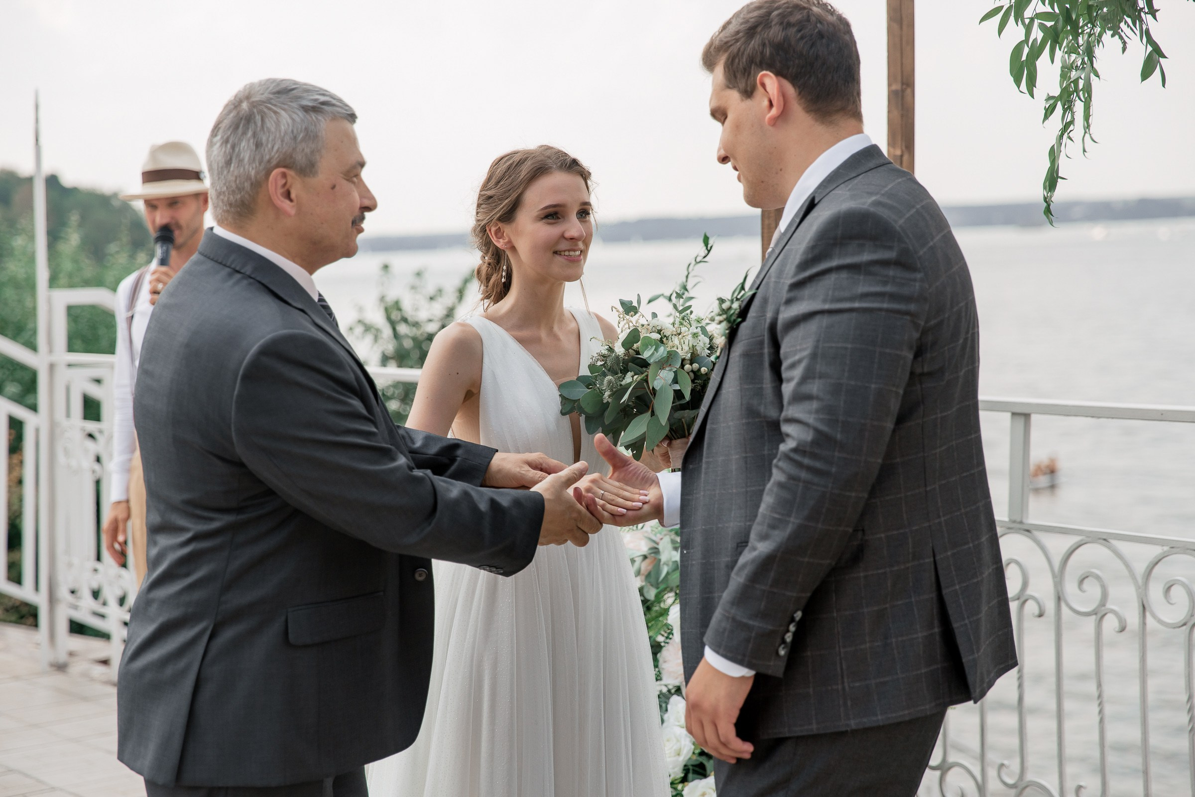 Father giving the bride to groom, by Bude, Cornwall reportage wedding photographer.