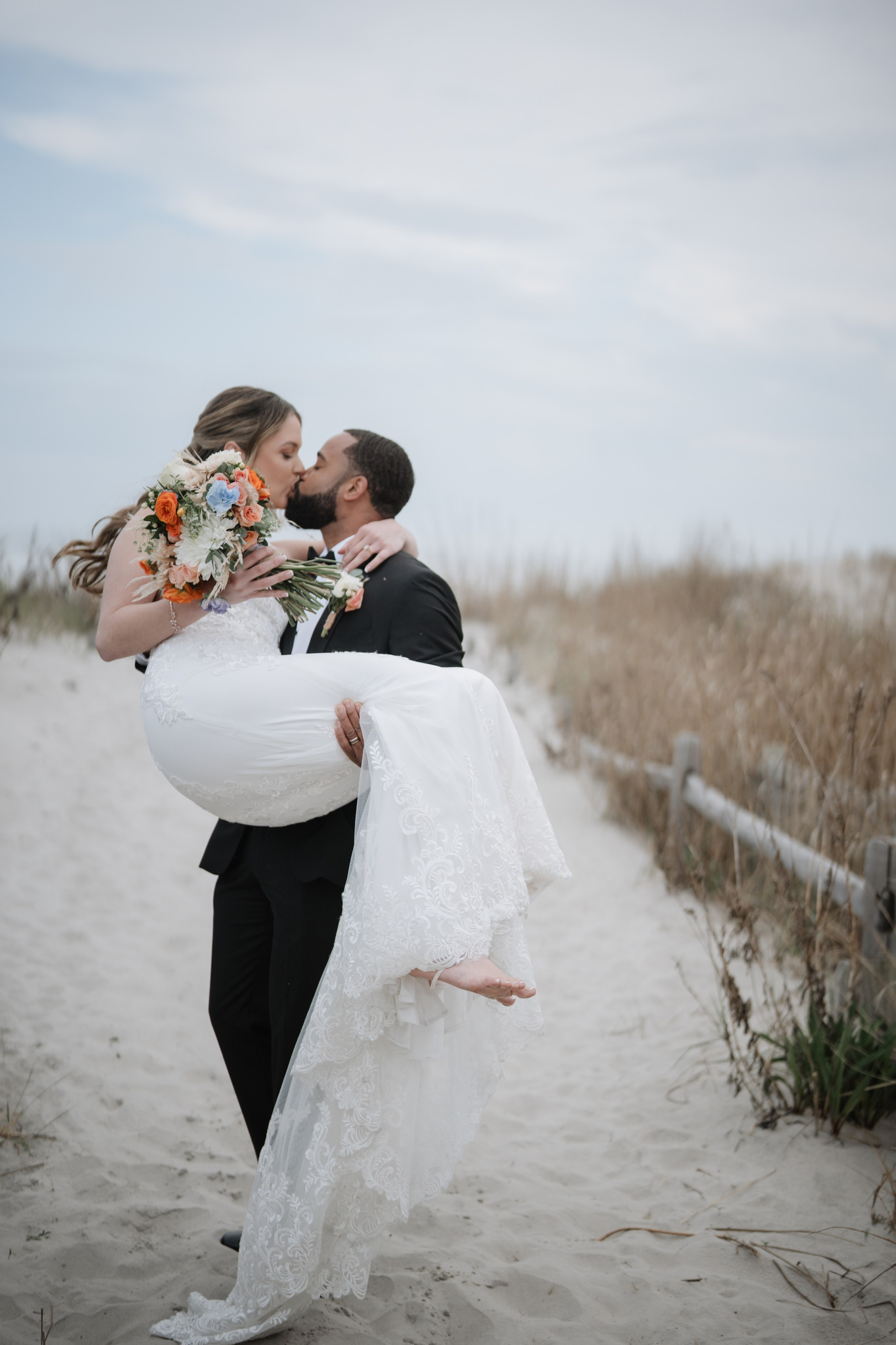 Wedding walk on the beach. Portrait and wedding photographer in New York