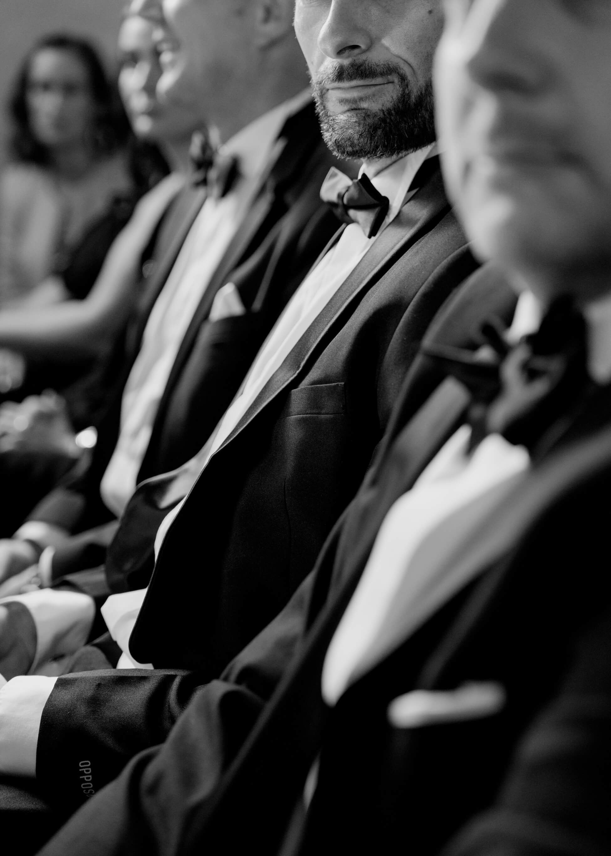 Wedding guests in black tie seated during church ceremony, luxury wedding Frankfurt