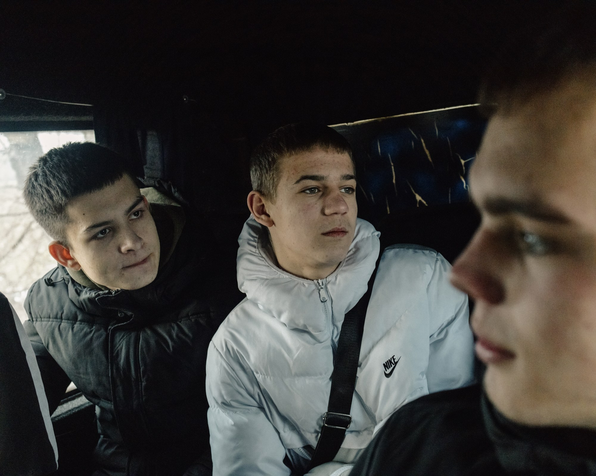Maxim (left), Vasily (middle), and Maxim (right), all 16, ride a marshrutka (minibus) to the village of Chitcani. The three are first-year college students in Tiraspol, the capital of Transnistria.