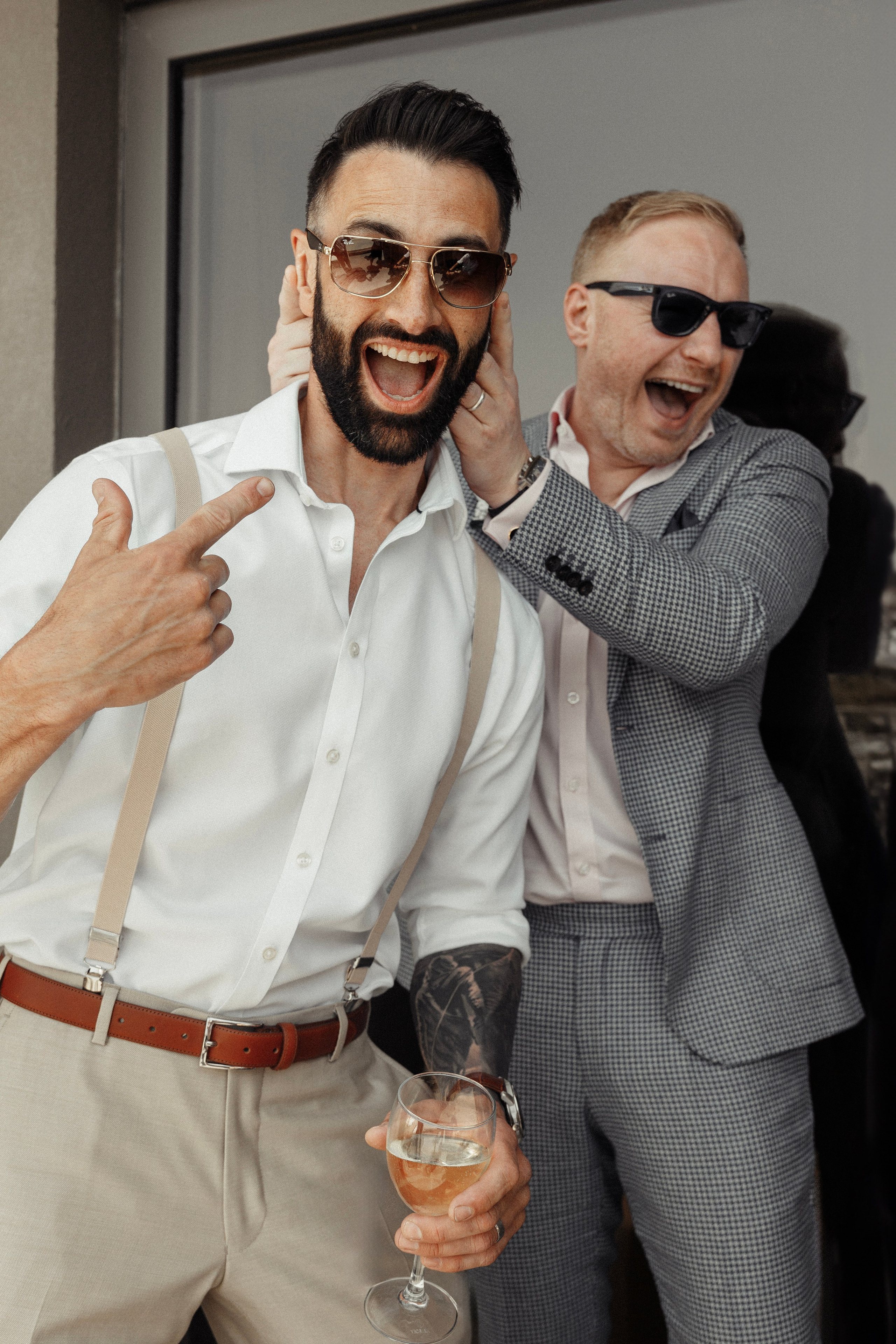 Candid moment of the groom's best friends laughing together at SHERATON HOTEL, Rhodes, Greece.