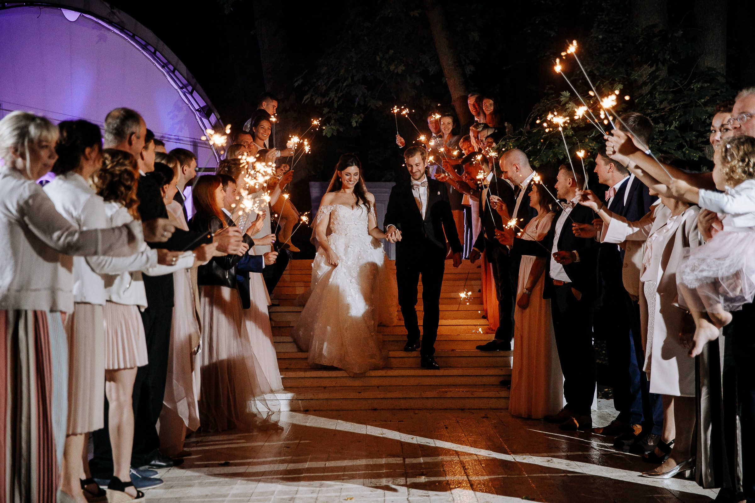 Guests with sparklers, by Bude, Cornwall wedding photographer.