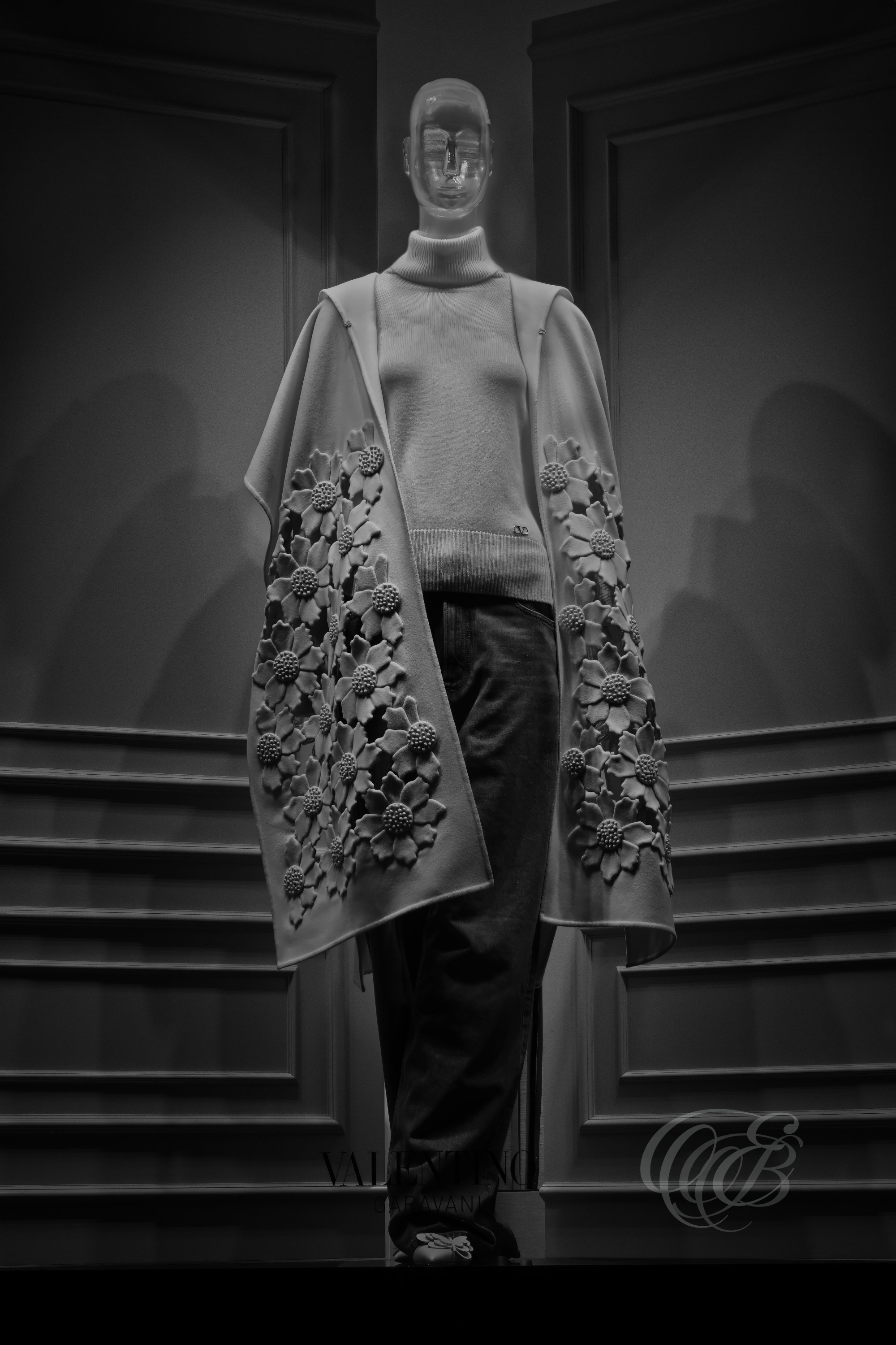 Rome, Italy – Valentino boutique window display in black and white fine art photography, mannequin in soft lighting centered in luxury fashion storefront window, reflective glass and curated display – fashion photography, Valentino Rome boutique – Eduardo Bartoli Photography.