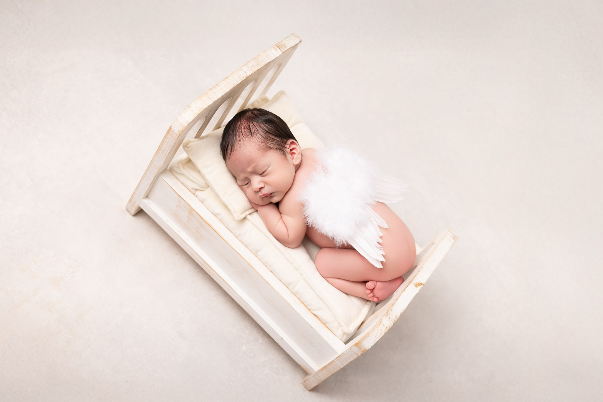 Angel Newborn Photoshoot. Professional family, maternity & newborn photographer in North Charleston, SC, creating timeless portraits