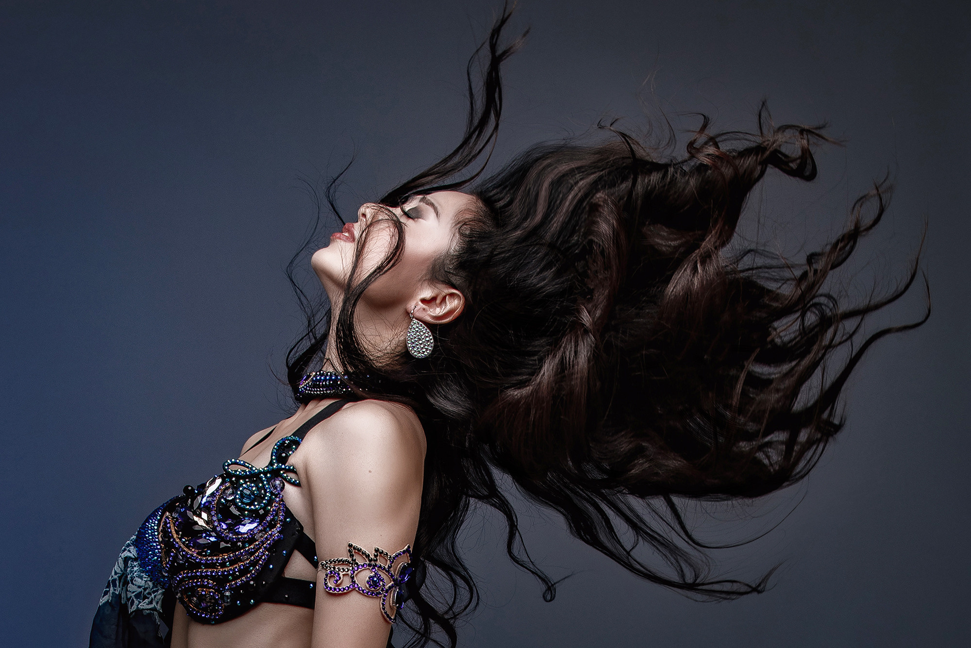Studio photo shoot. Dancer in motion, developing hair. Photographer in Shanghai