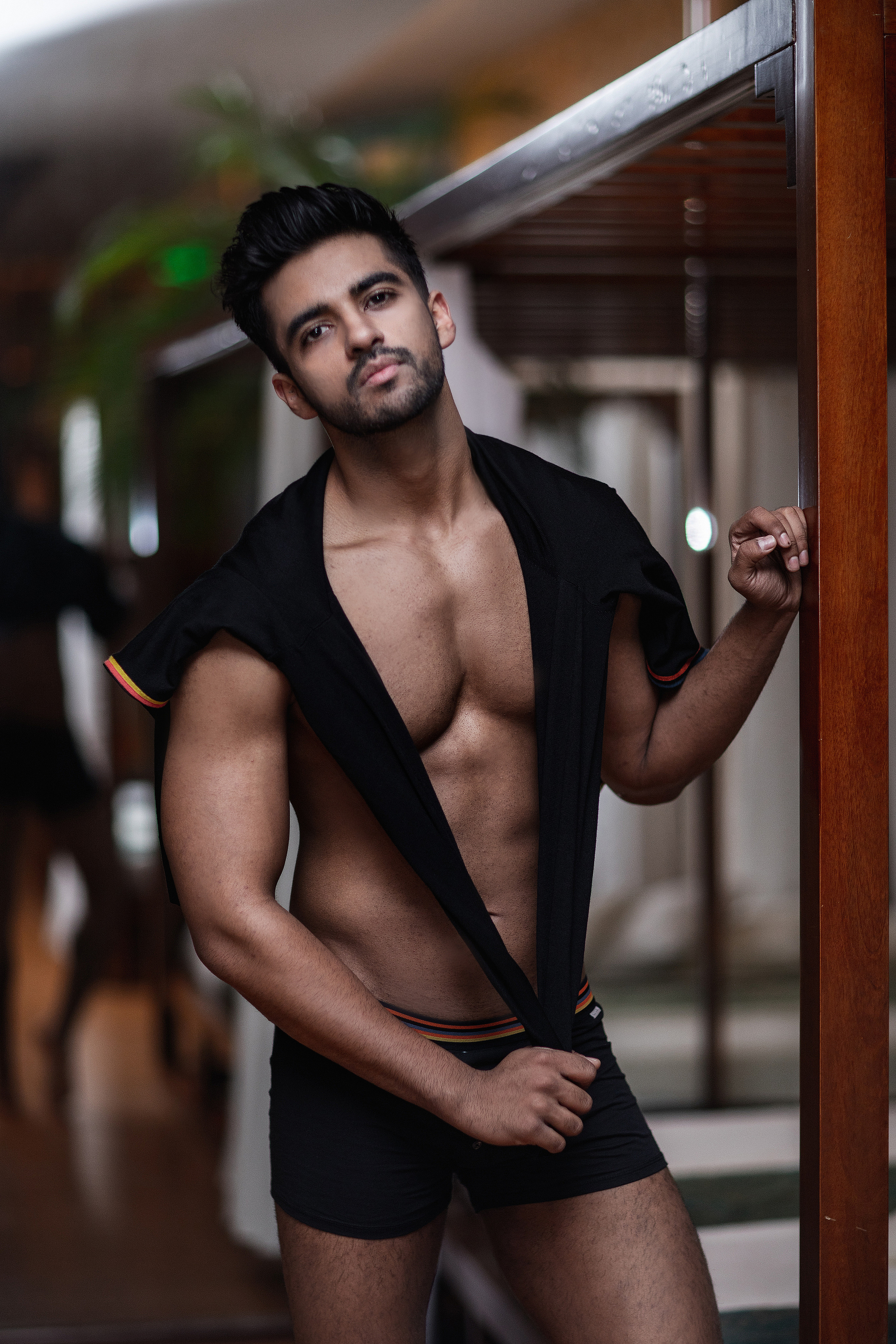 Athletic build, charming man, Hindu. In the gym of a luxury hotel