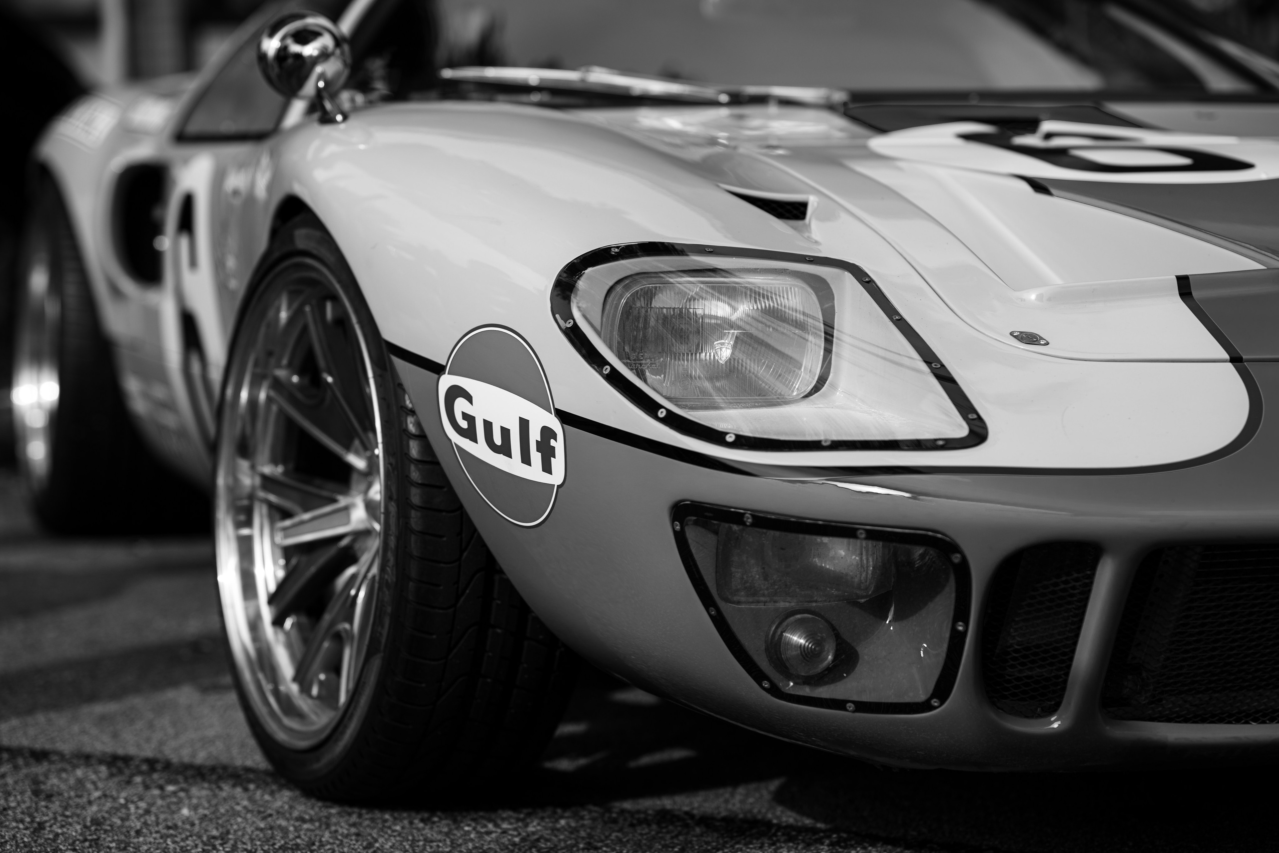 Ford GT40 Gulf-livery front quarter – dramatic monochrome close-up of a race-bred Ford GT40 with iconic Gulf logo, highlighting commercial automotive imagery by a Singapore freelance photographer.