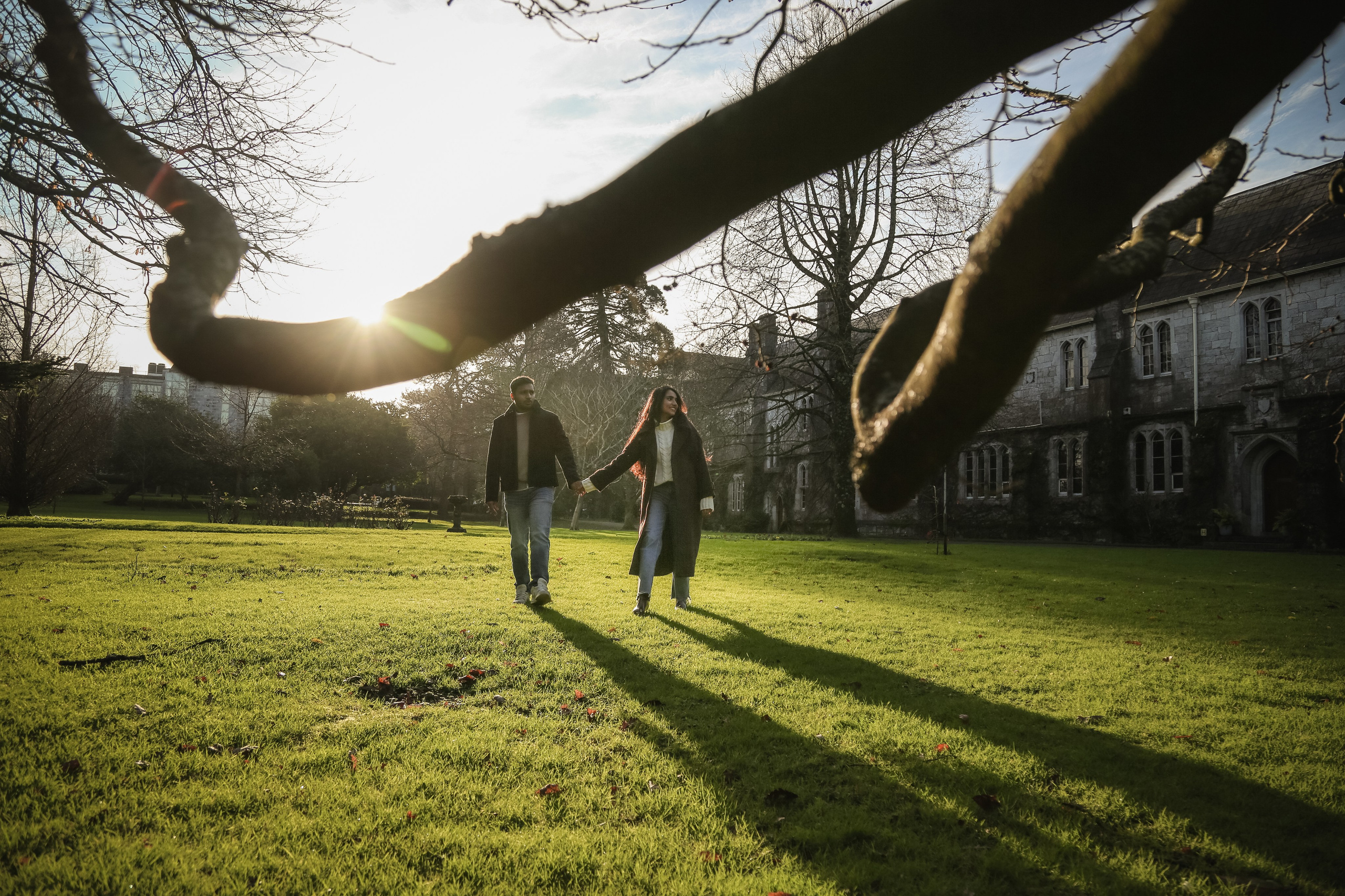 A cinematic moment captured at golden light, where long shadows and open space enhance movement and intimacy.