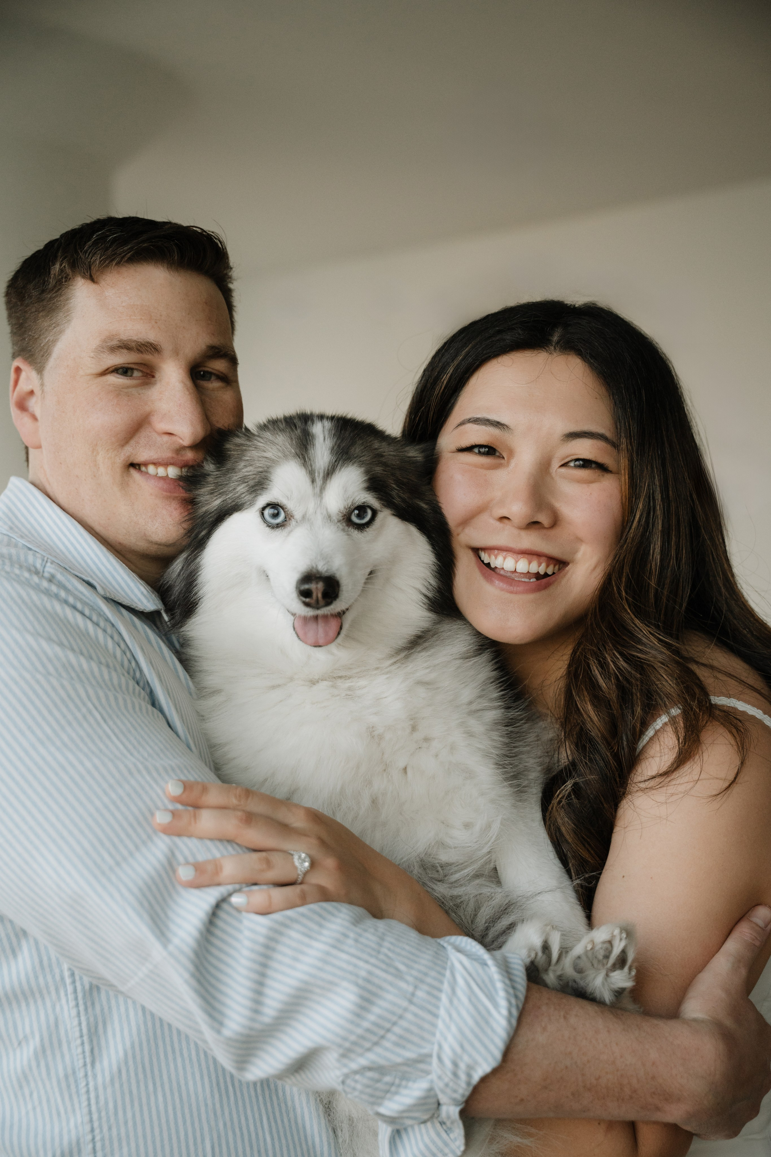 An adorable couple with their dog. Portrait and wedding photographer in New York