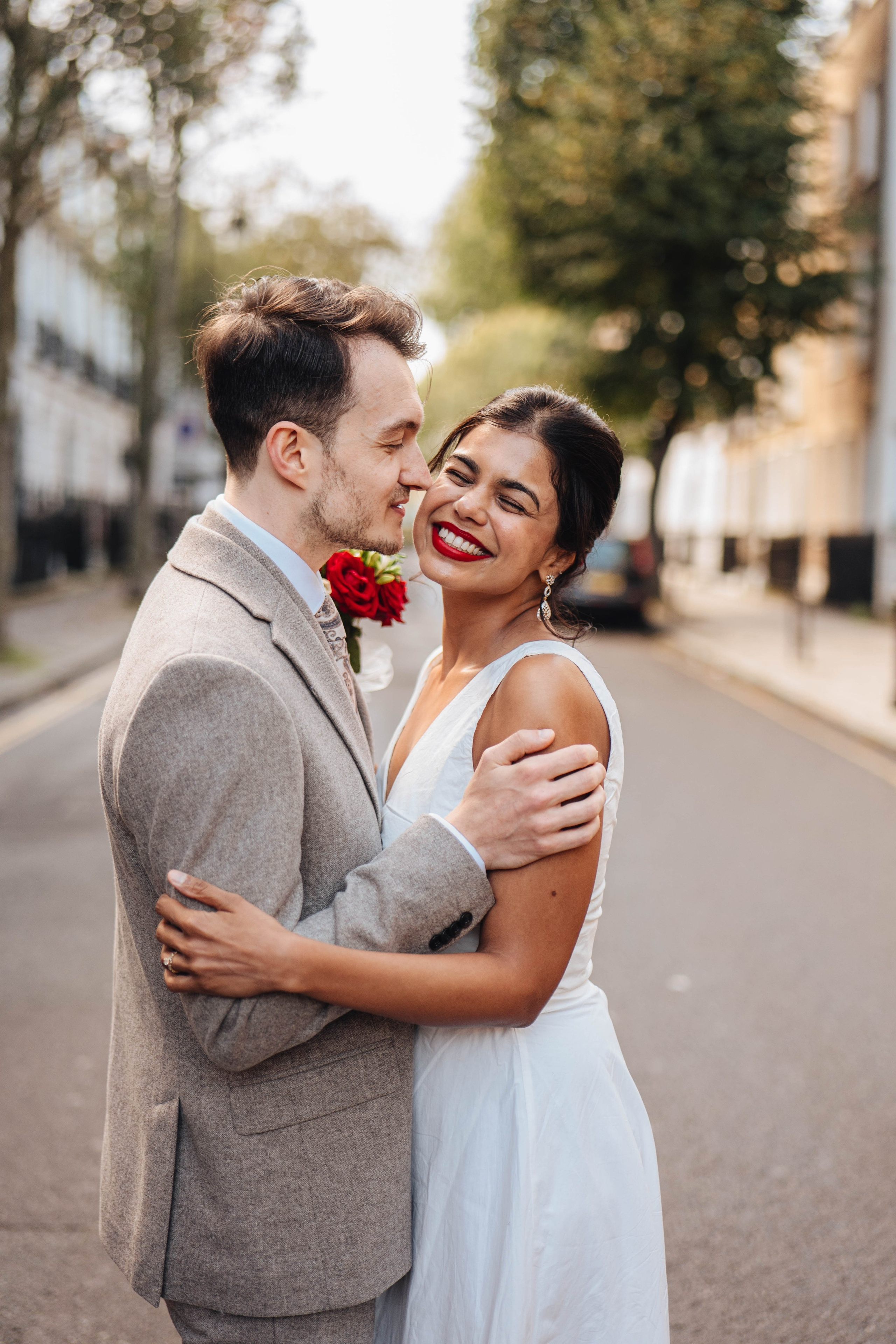 Wedding couple on the road crossing in Islington near Islington town hall