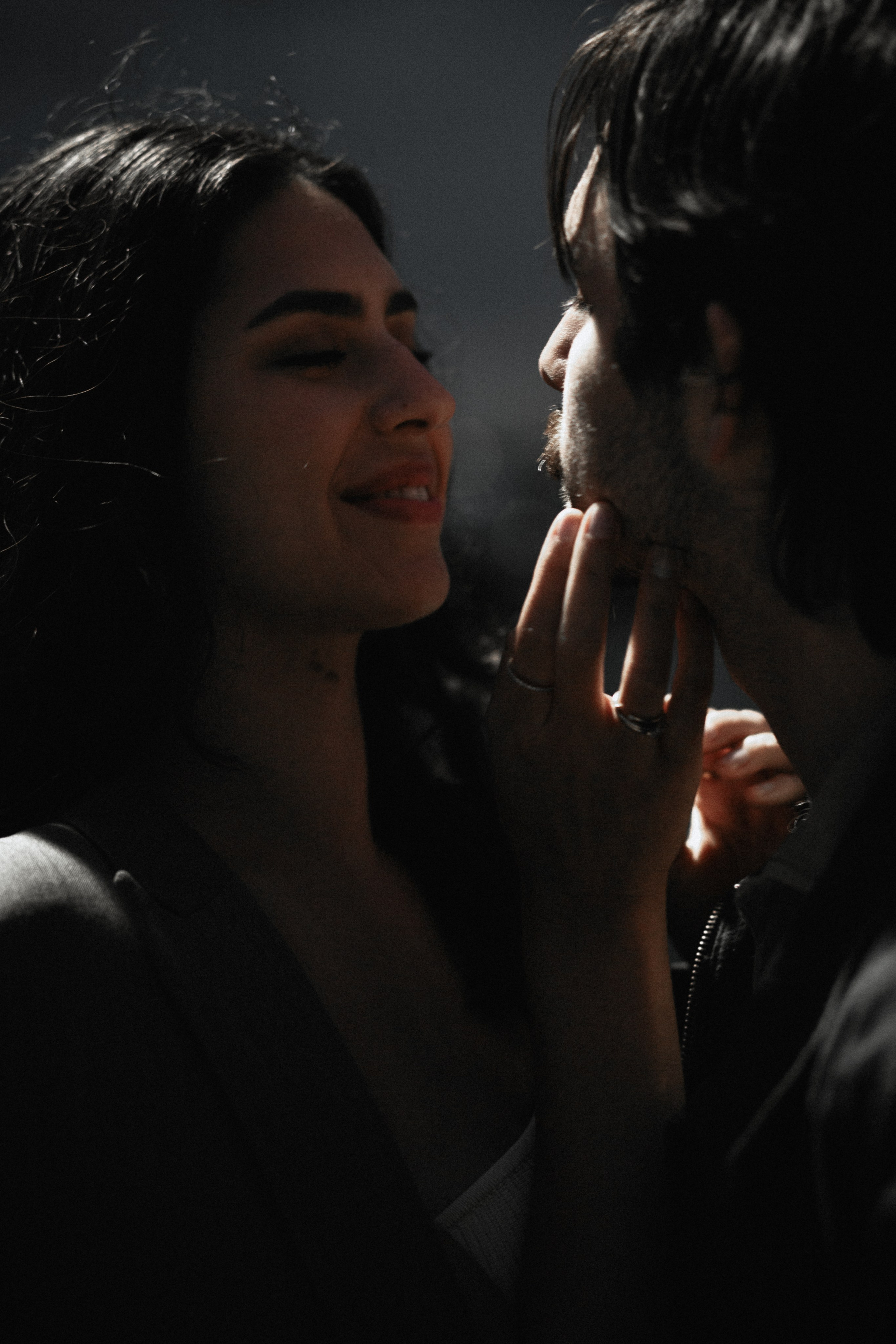 Romantic couple close-up during golden hour in Calpe, Spain — intimate gaze and soft touch capture the warmth and connection of a love story photoshoot. Perfect for couples looking for emotional and candid couple photography in Calpe or throughout Spain.