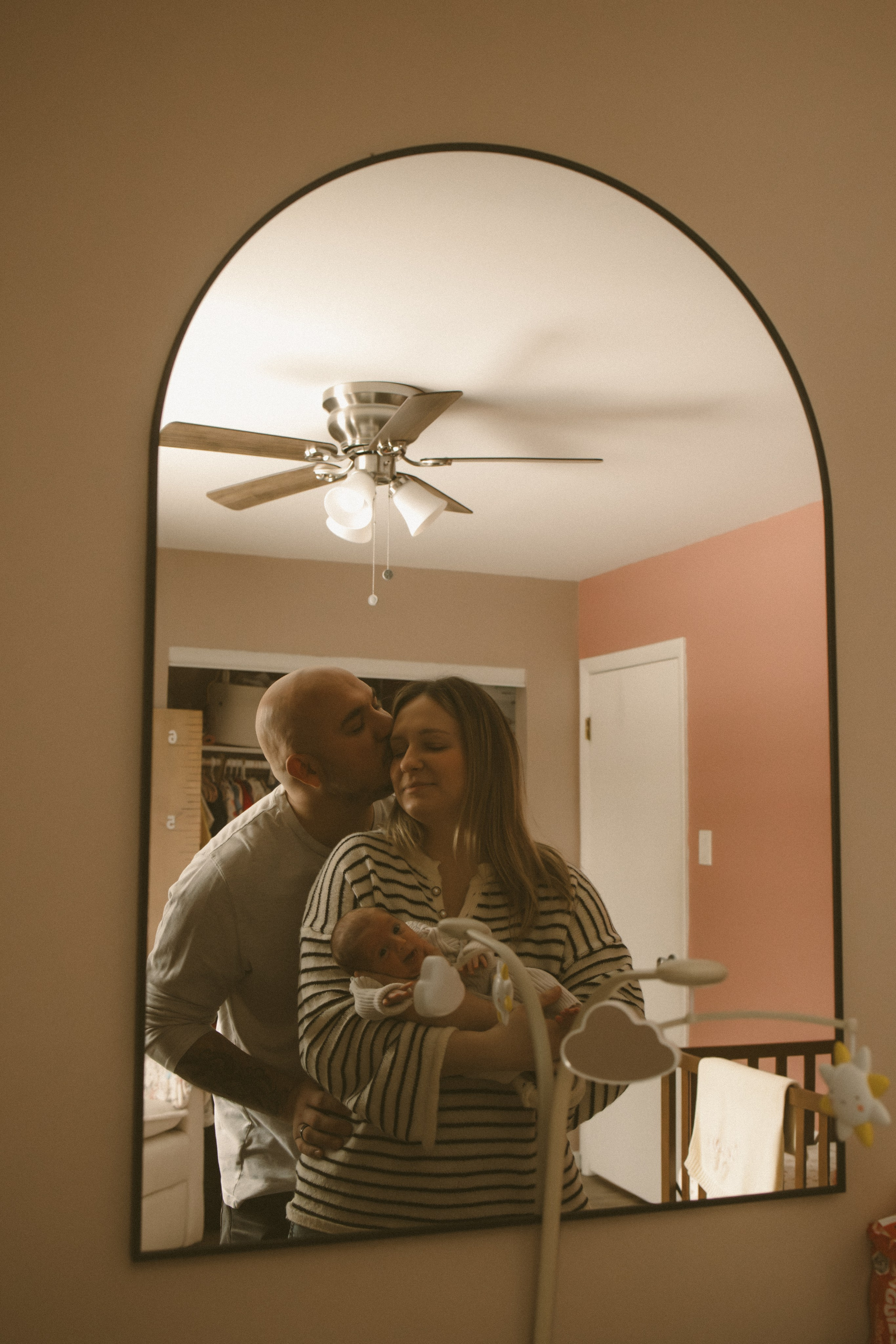 Mom and dad holding their newborn baby and enjoying that sweet moment South Jersey family photoshoot