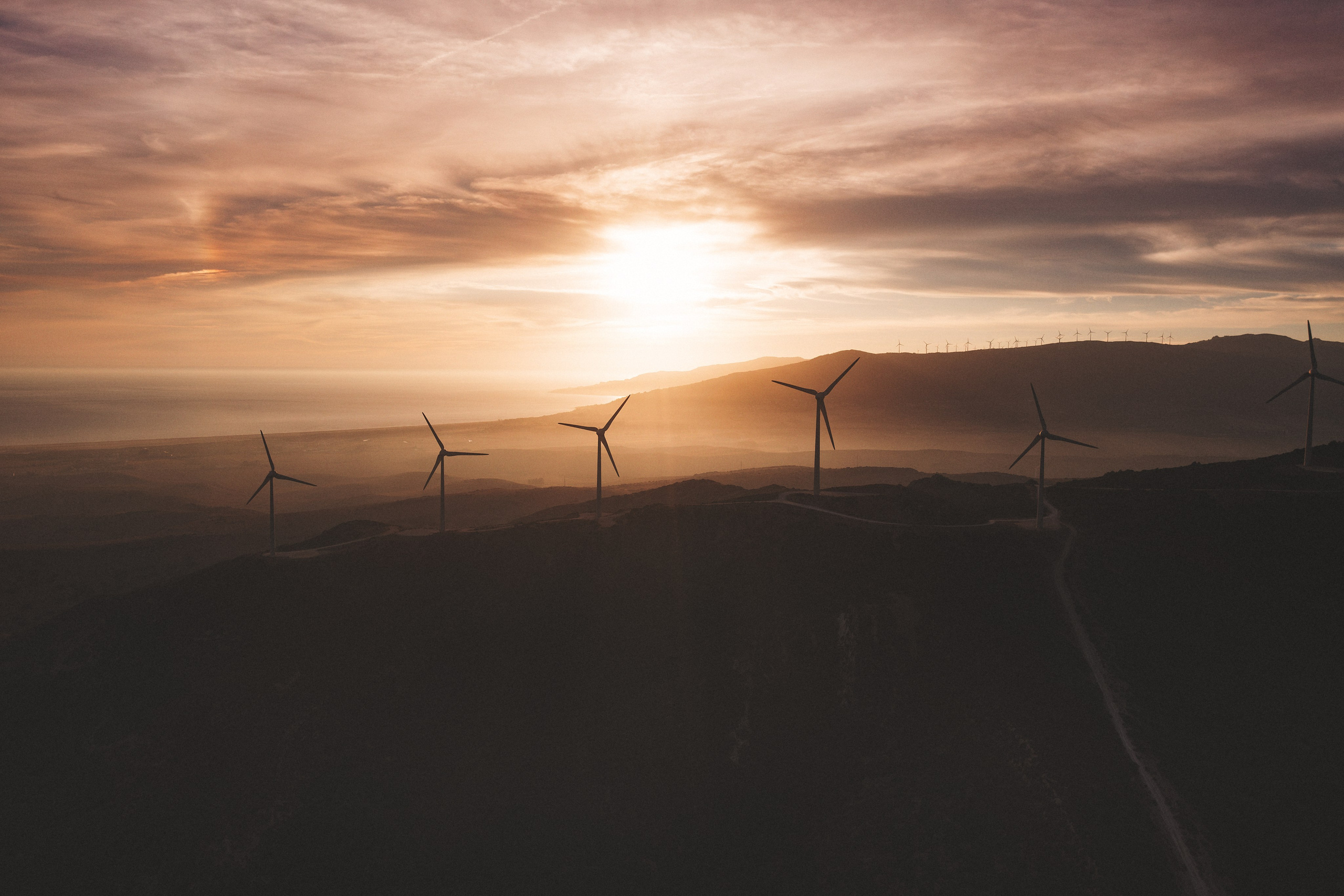 Drone photography of Tarifa’s wind farms and green hills by Marbella real estate photographer