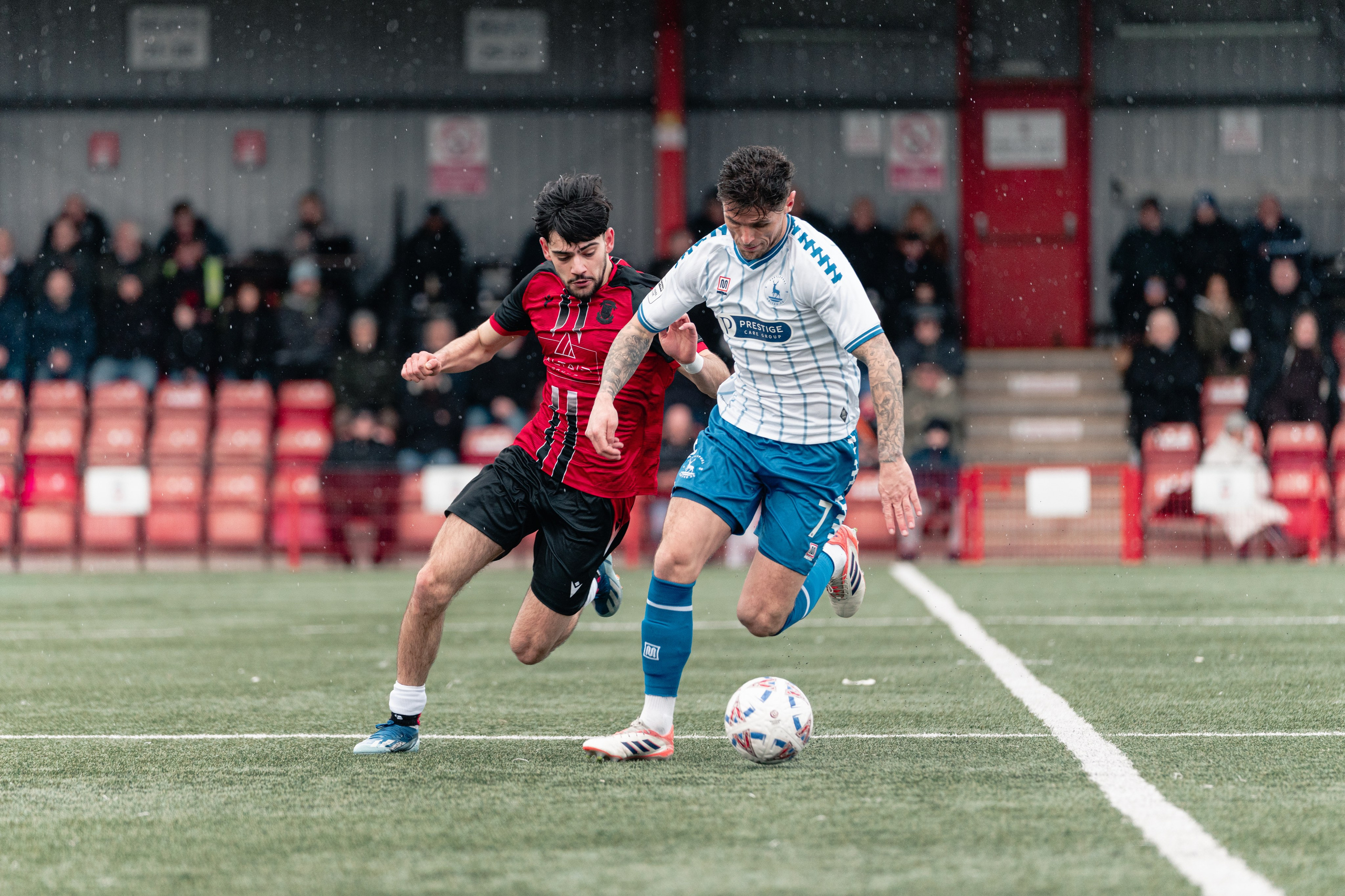 Ronan Maher closes down Gavan Holohan as Sheron carries the ball during Tamworth vs Hartlepool at The Lamb Ground.