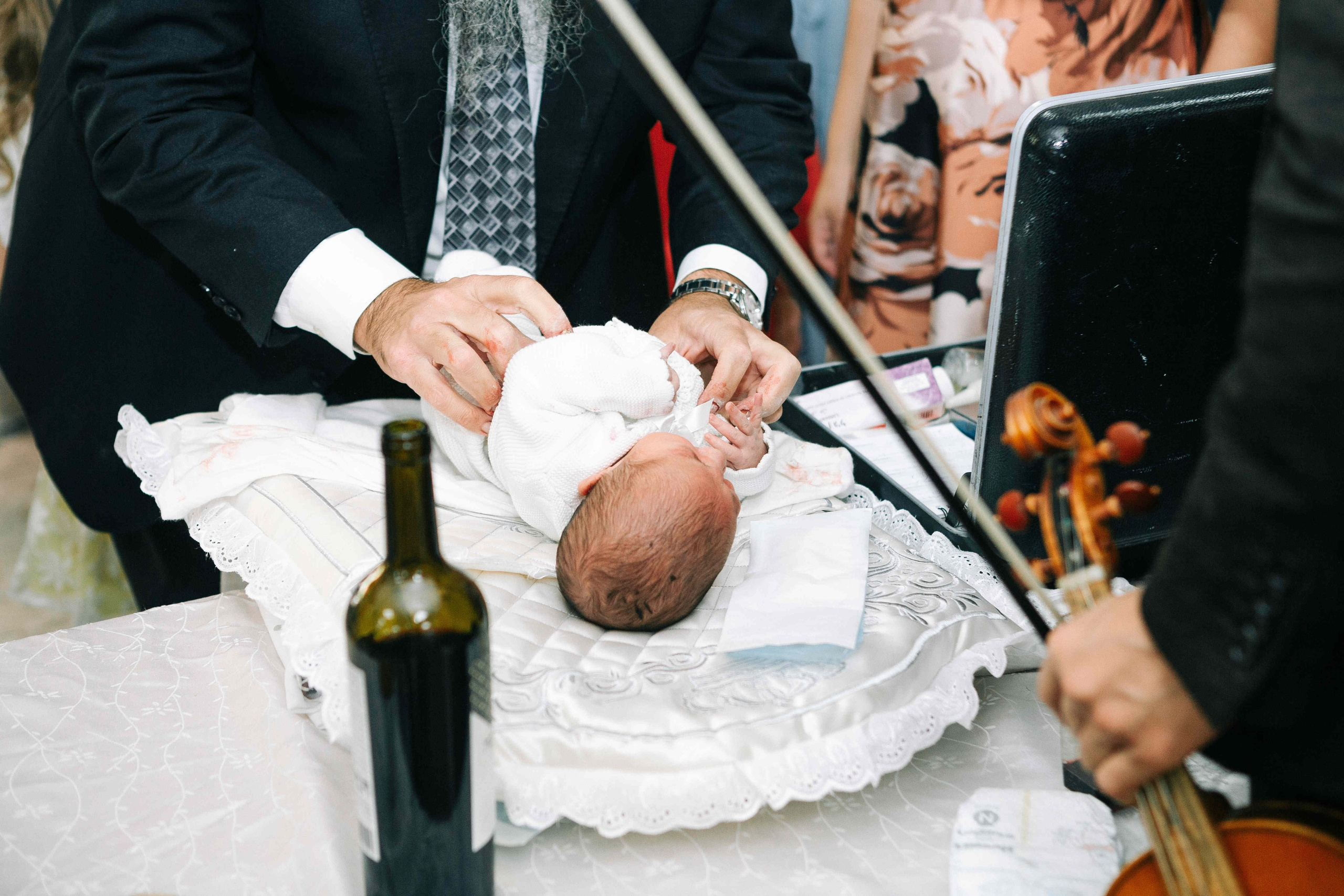 BRITH MILA IN THE SMALL SYNAGOGUE. PHOTOGRAPHER IN ISRAEL