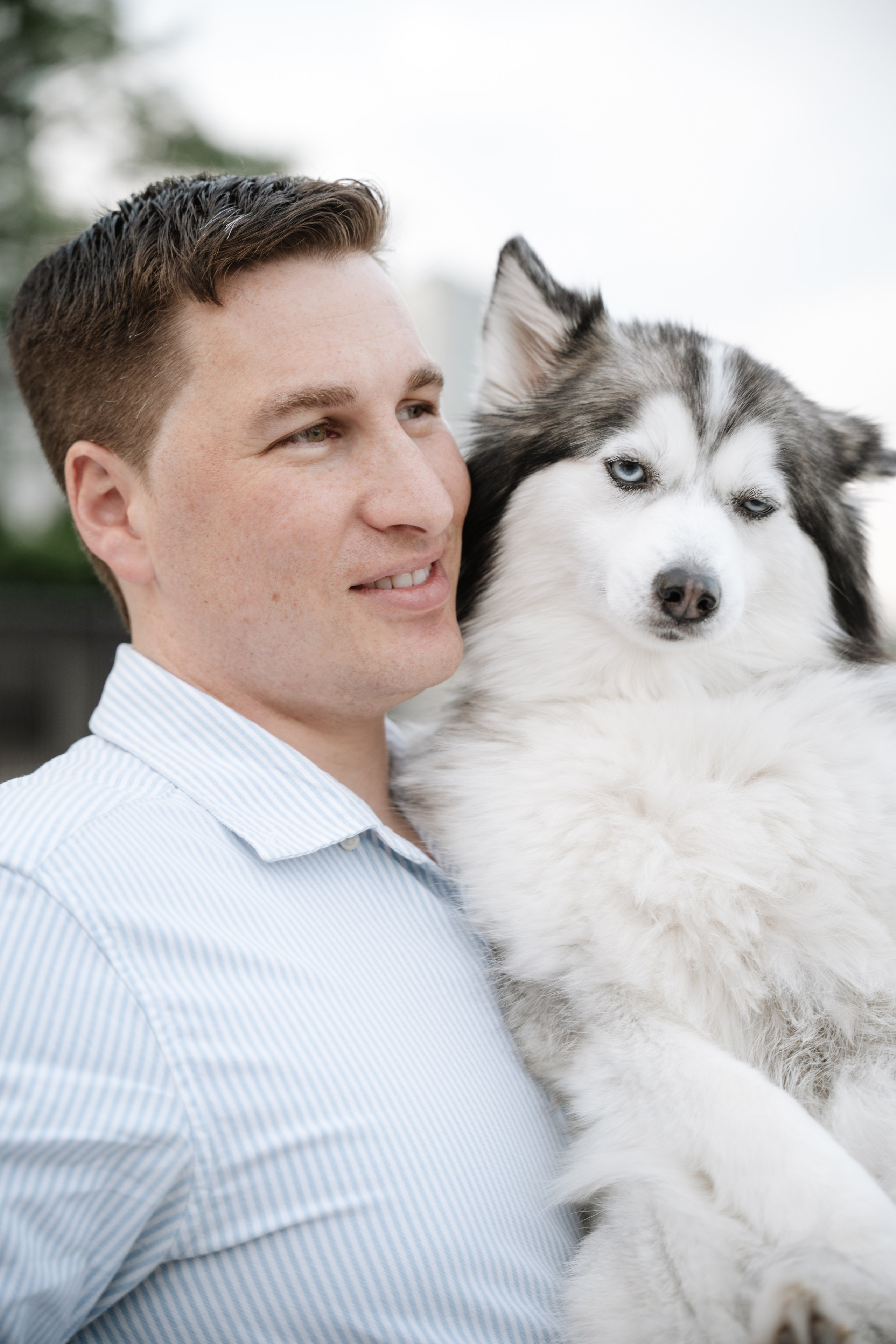 An adorable couple with their dog. Portrait and wedding photographer in New York