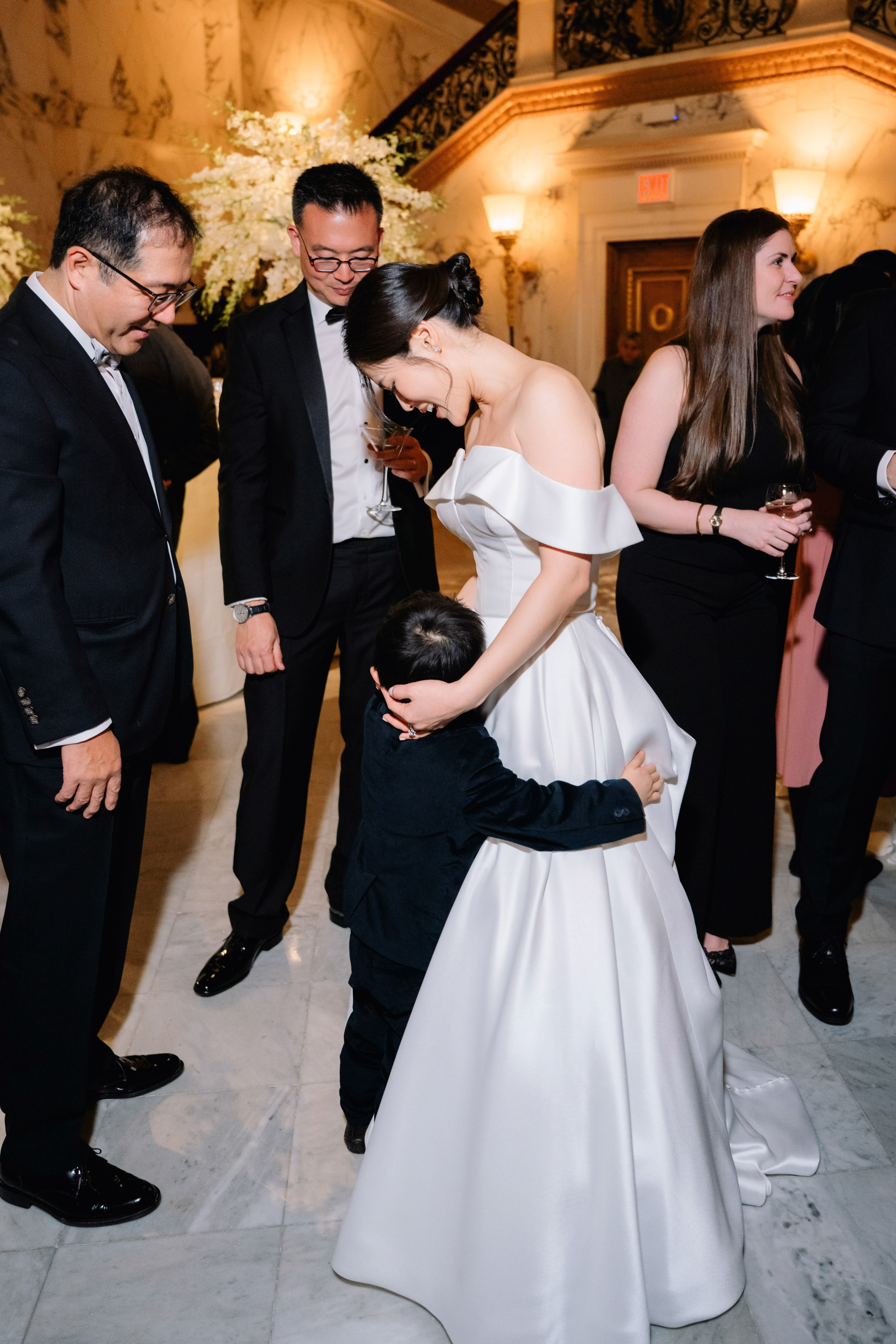 a bride and groom are getting ready to get into their wedding dress