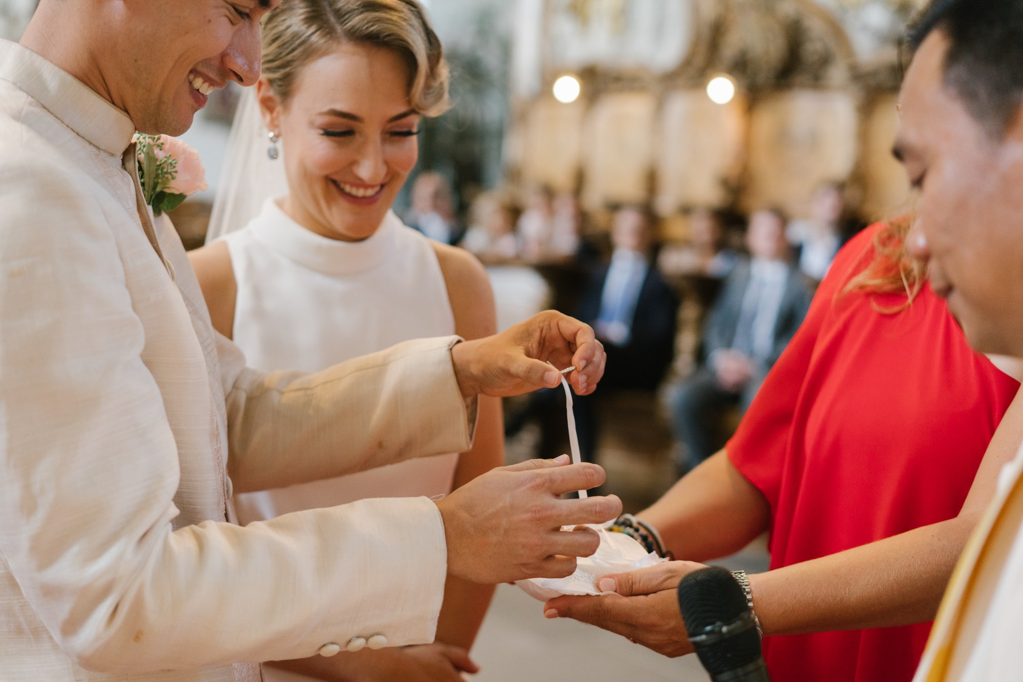 couple is exchanging rings with each other 