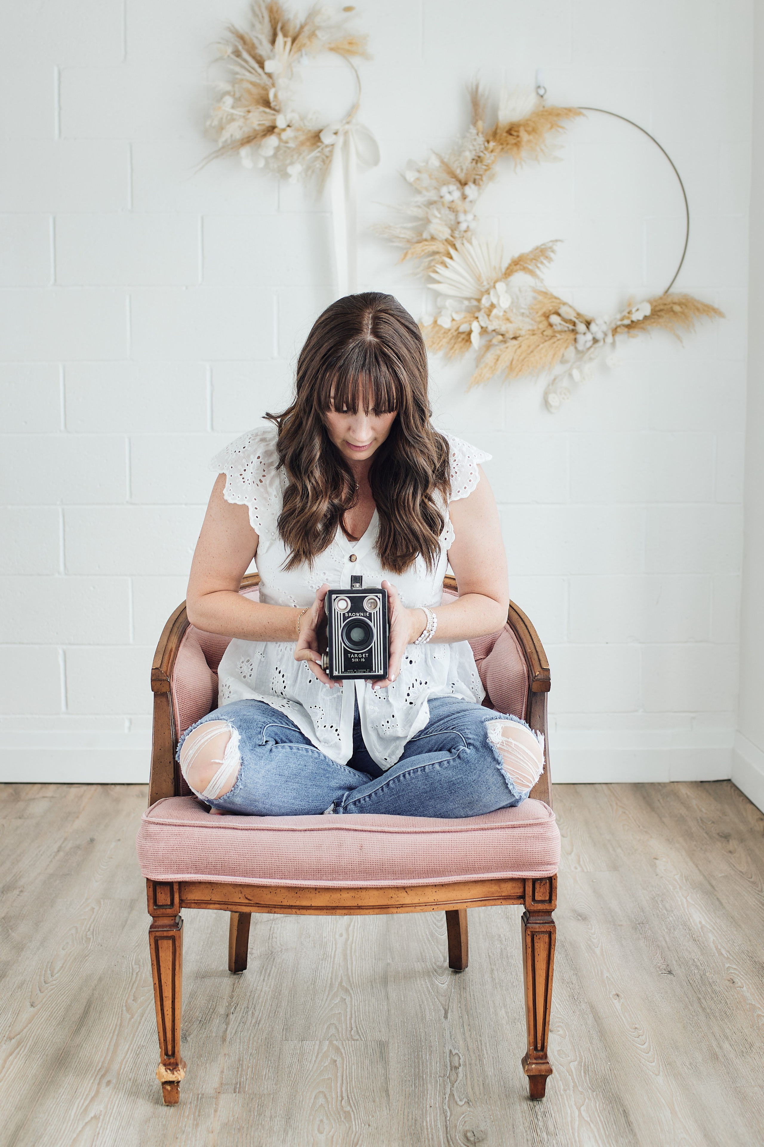 headshot of a photographer holding camera 