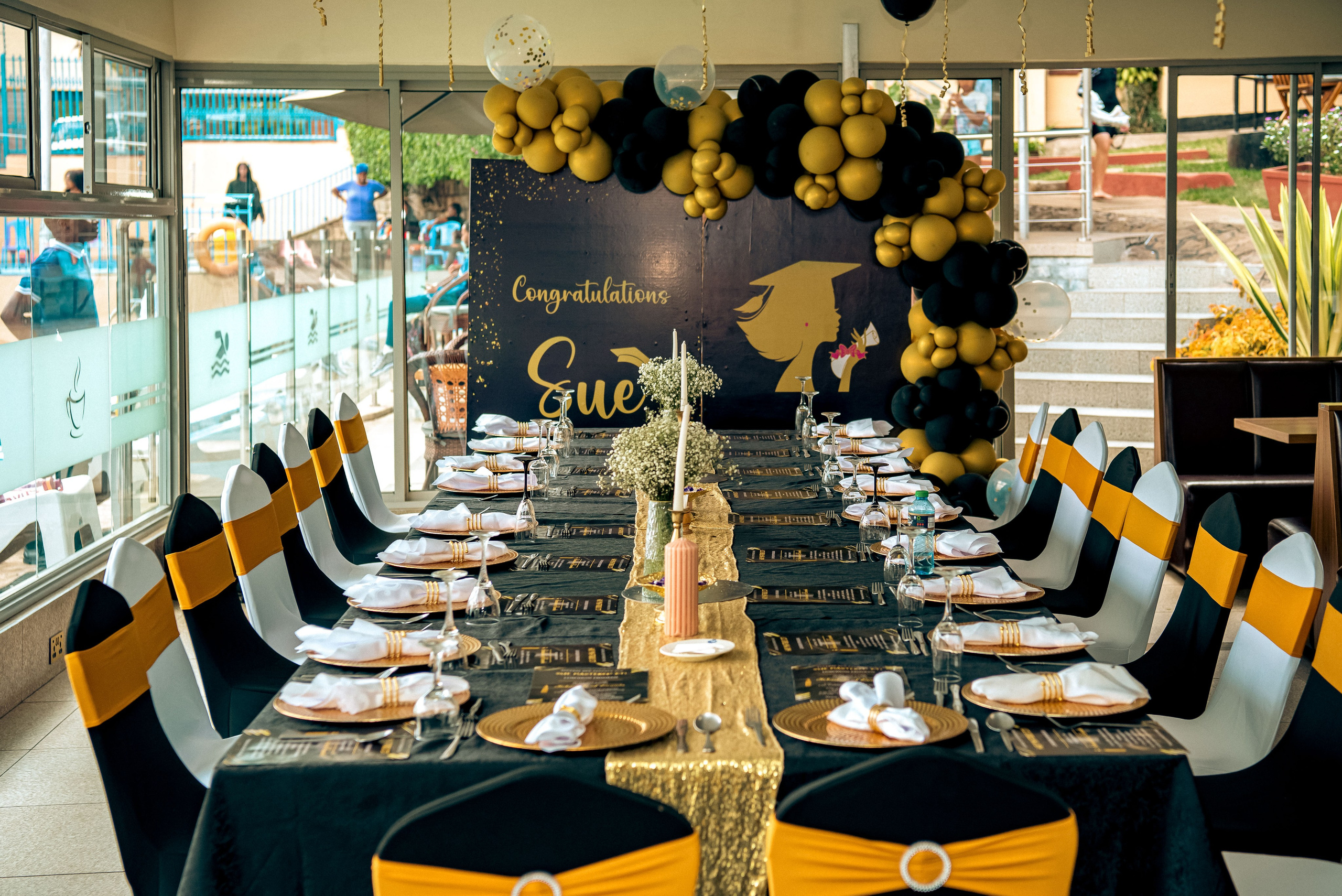 Graduation event décor setup with long table and backdrop in Nairobi