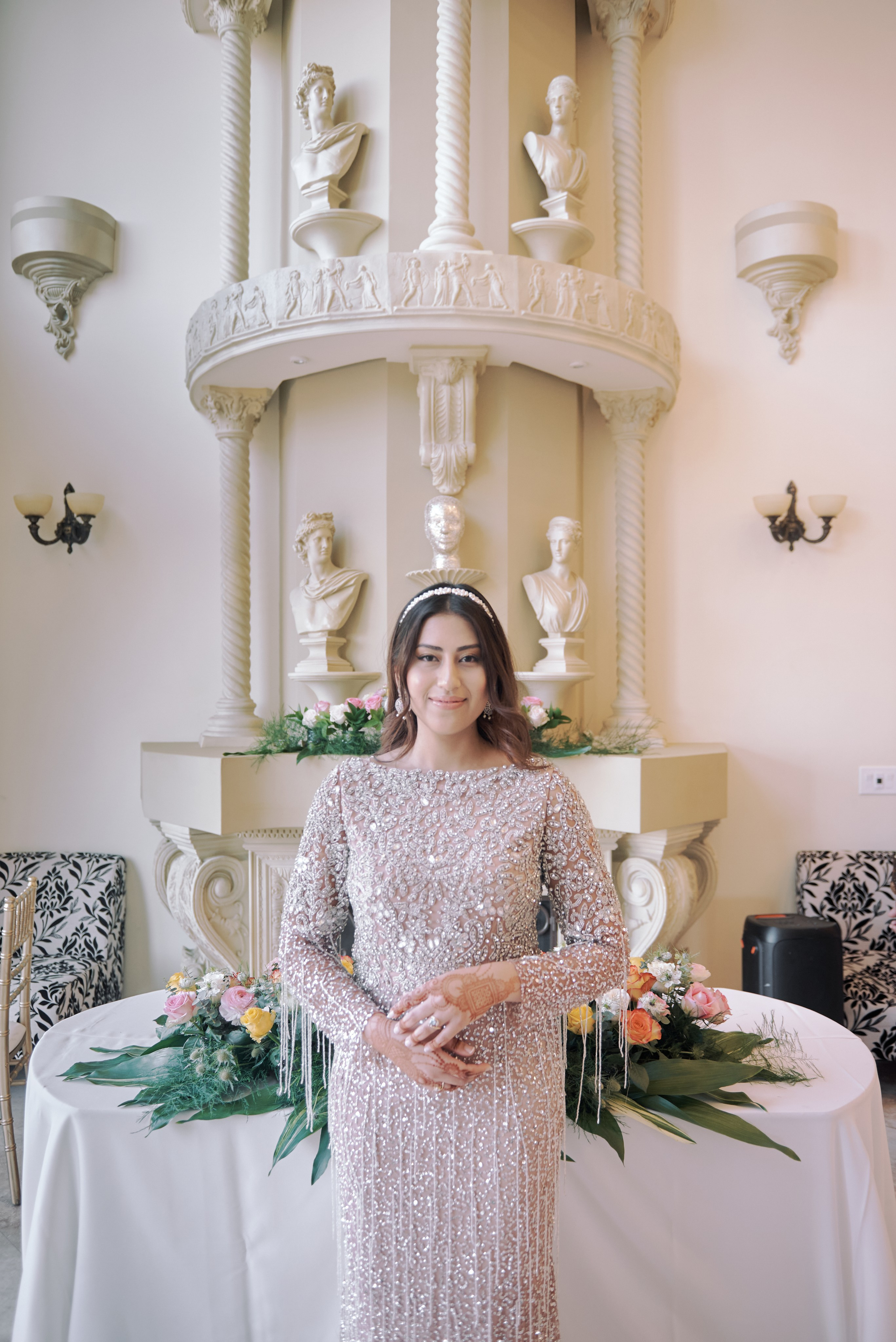 Stylish engagement photo of a couple posing by the Hollywood sign in Los Angeles