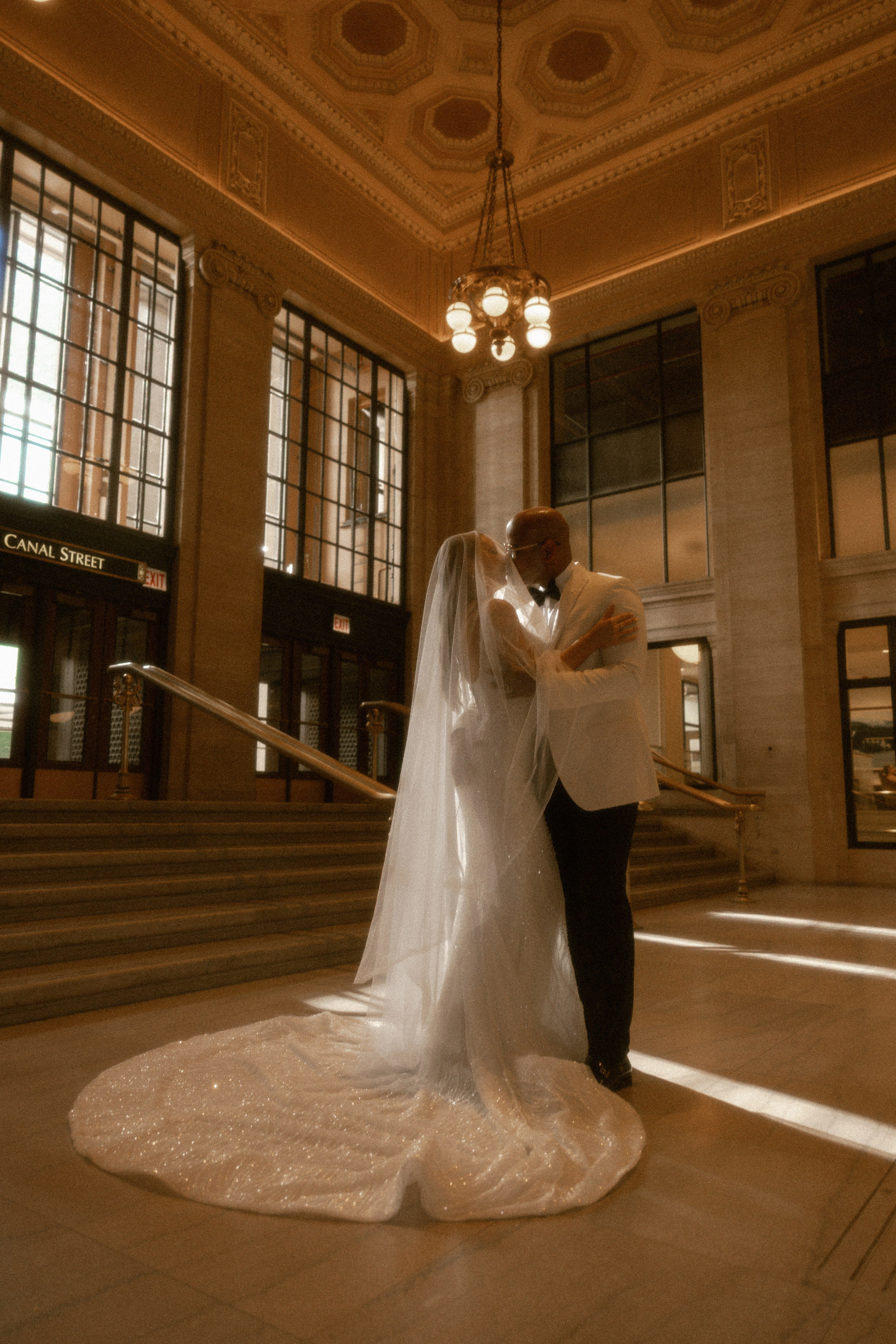 Bride and groom portraits in front of Chicago theater sign