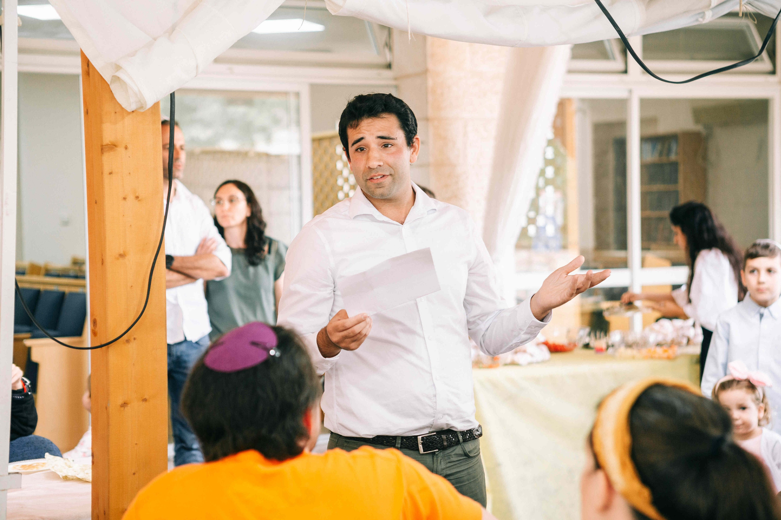 BRITH MILA IN THE SMALL SYNAGOGUE. PHOTOGRAPHER IN ISRAEL