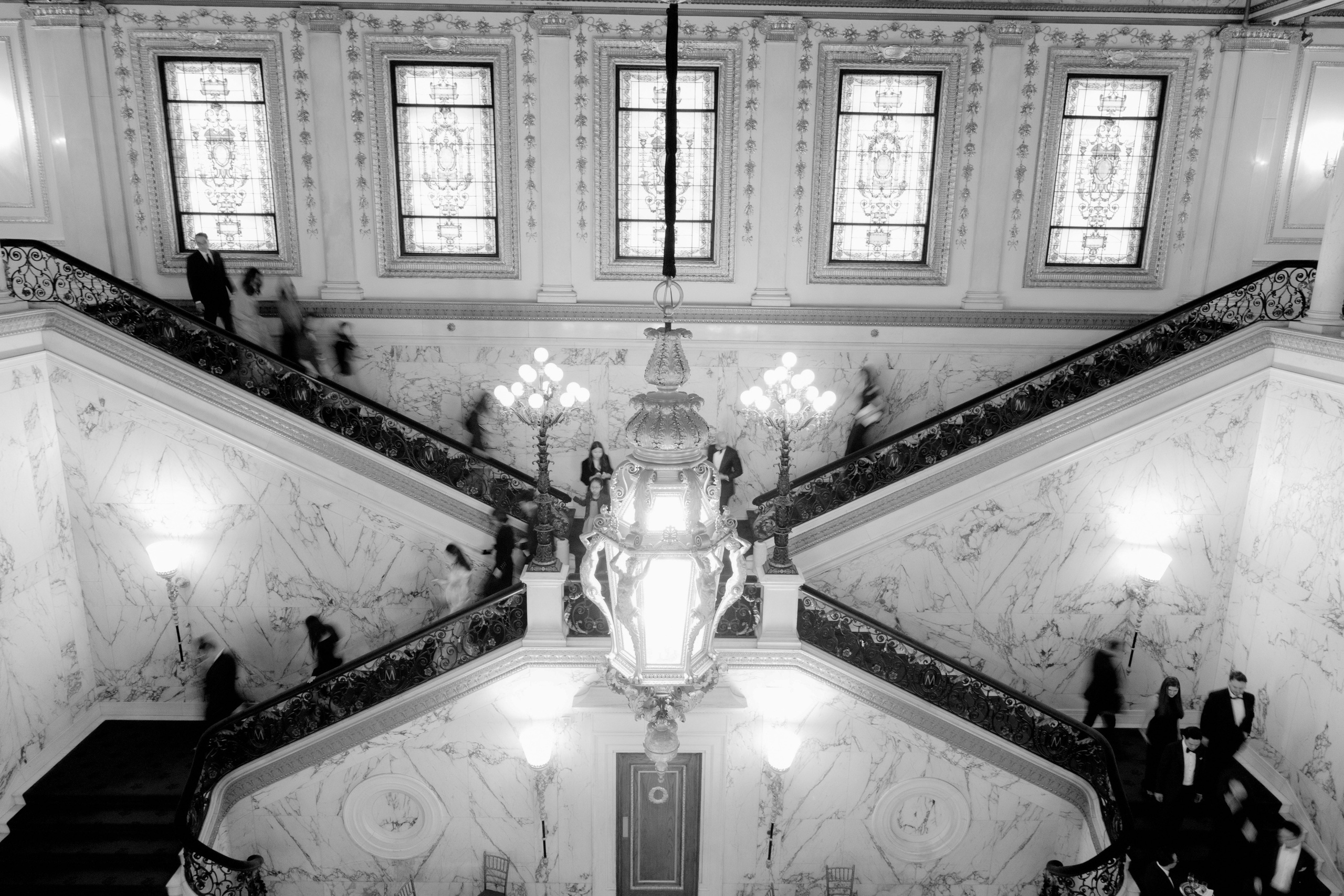 a staircase with a statue on the top