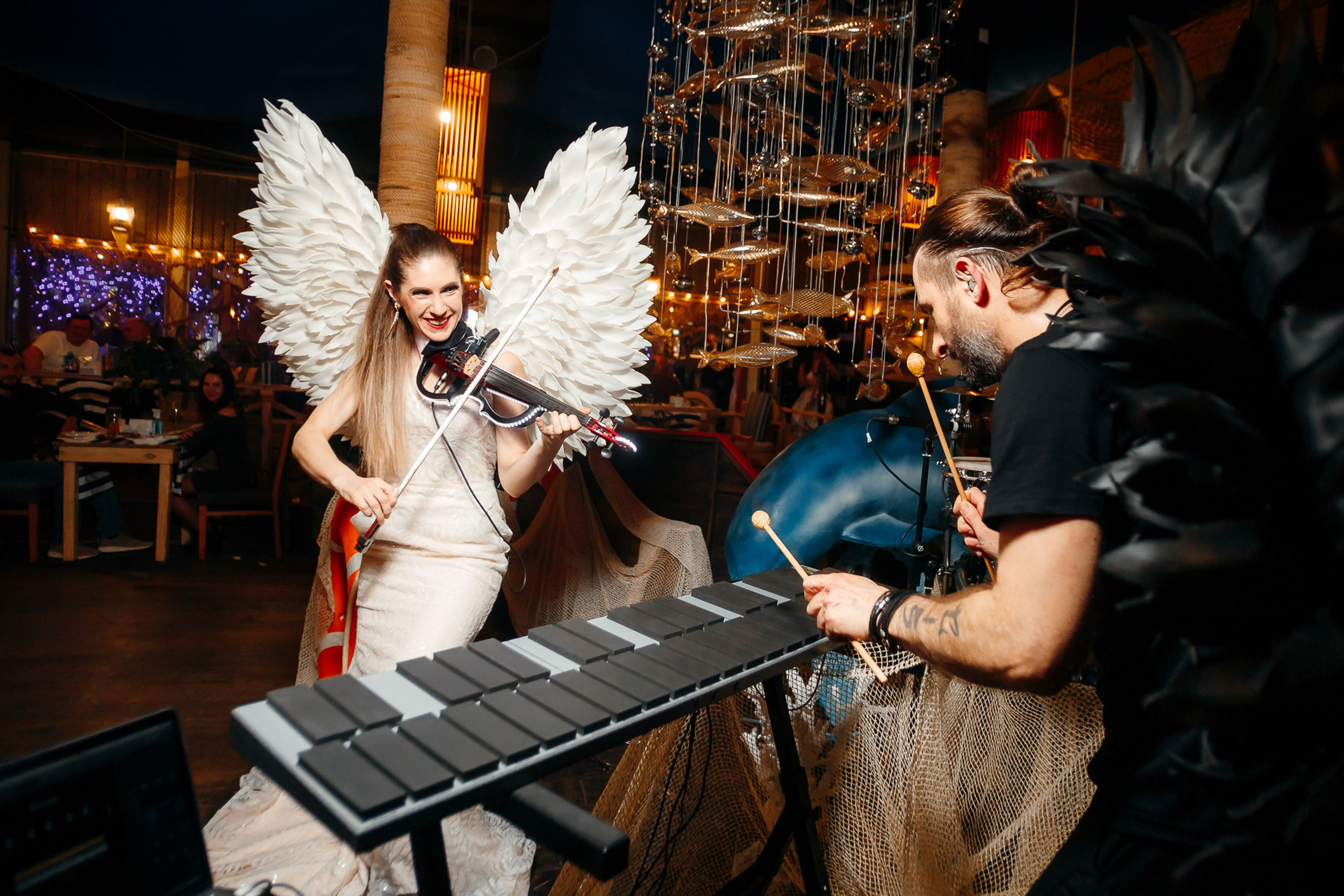 Woman in bunny ears dancing at costume party