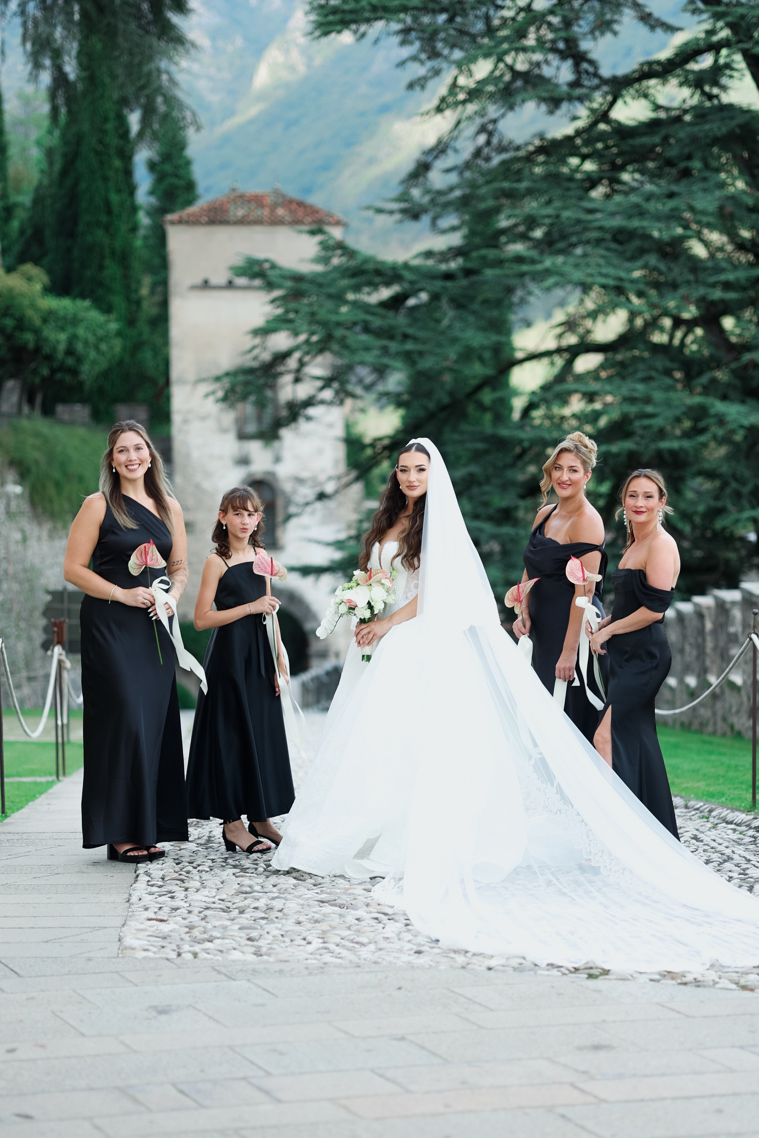 Candid moment of the bride surrounded by bridesmaids during preparations.