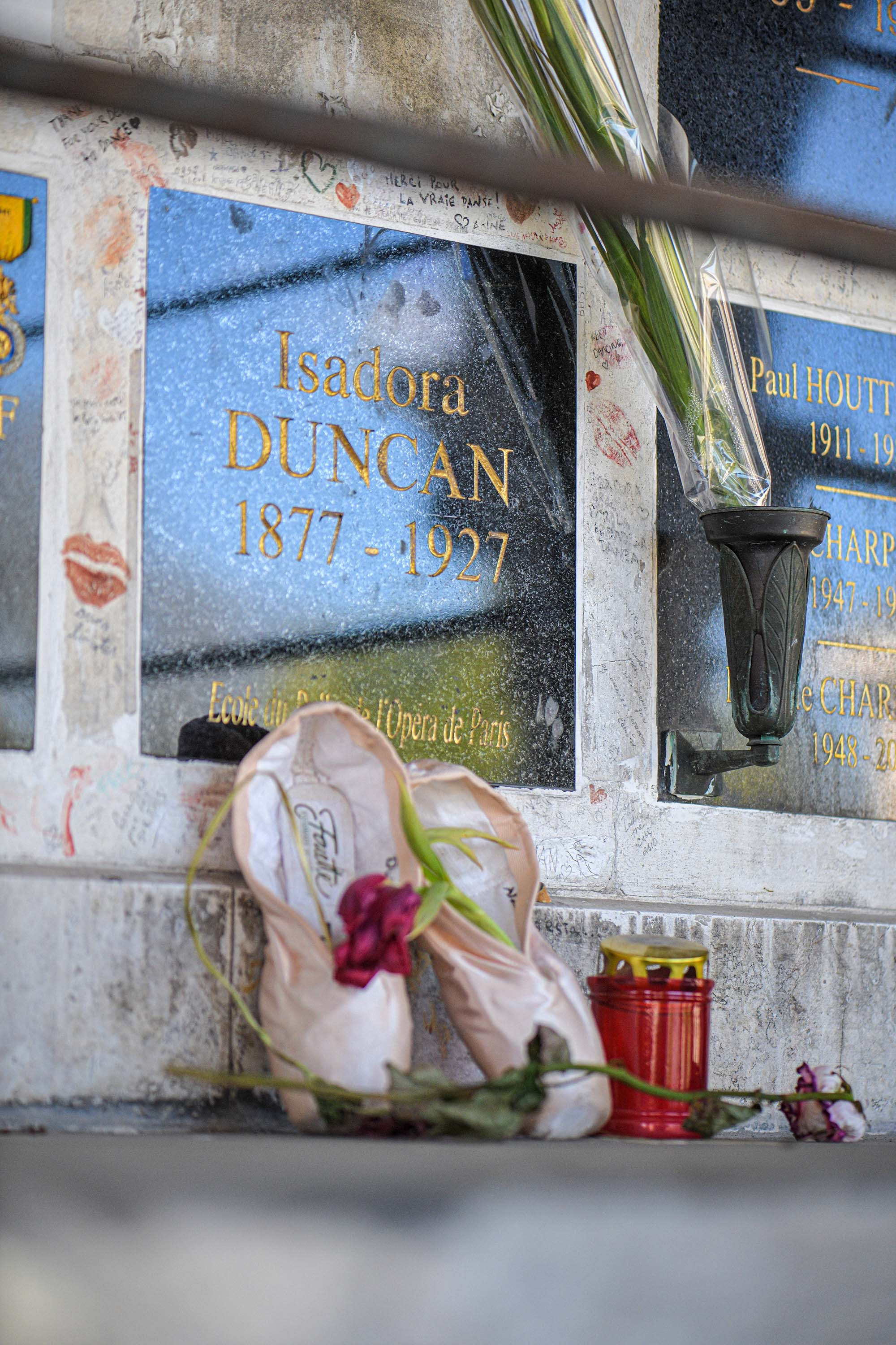 Isadora Duncan's grave at Père Lachaise Cemetery in Paris, France, with ballet shoes left in tribute.