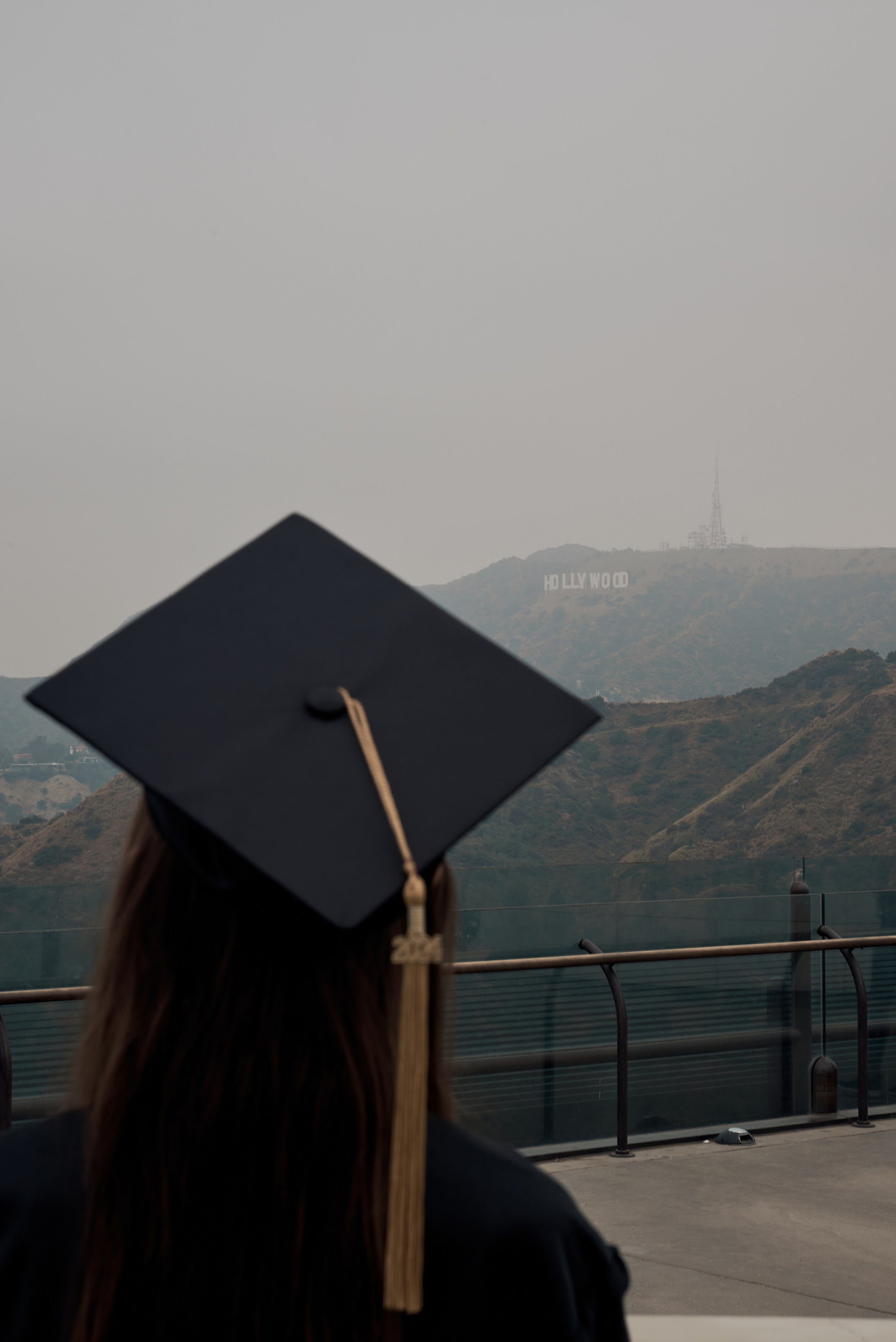 Graduate and friends sharing a joyous moment in a Los Angeles botanical garden