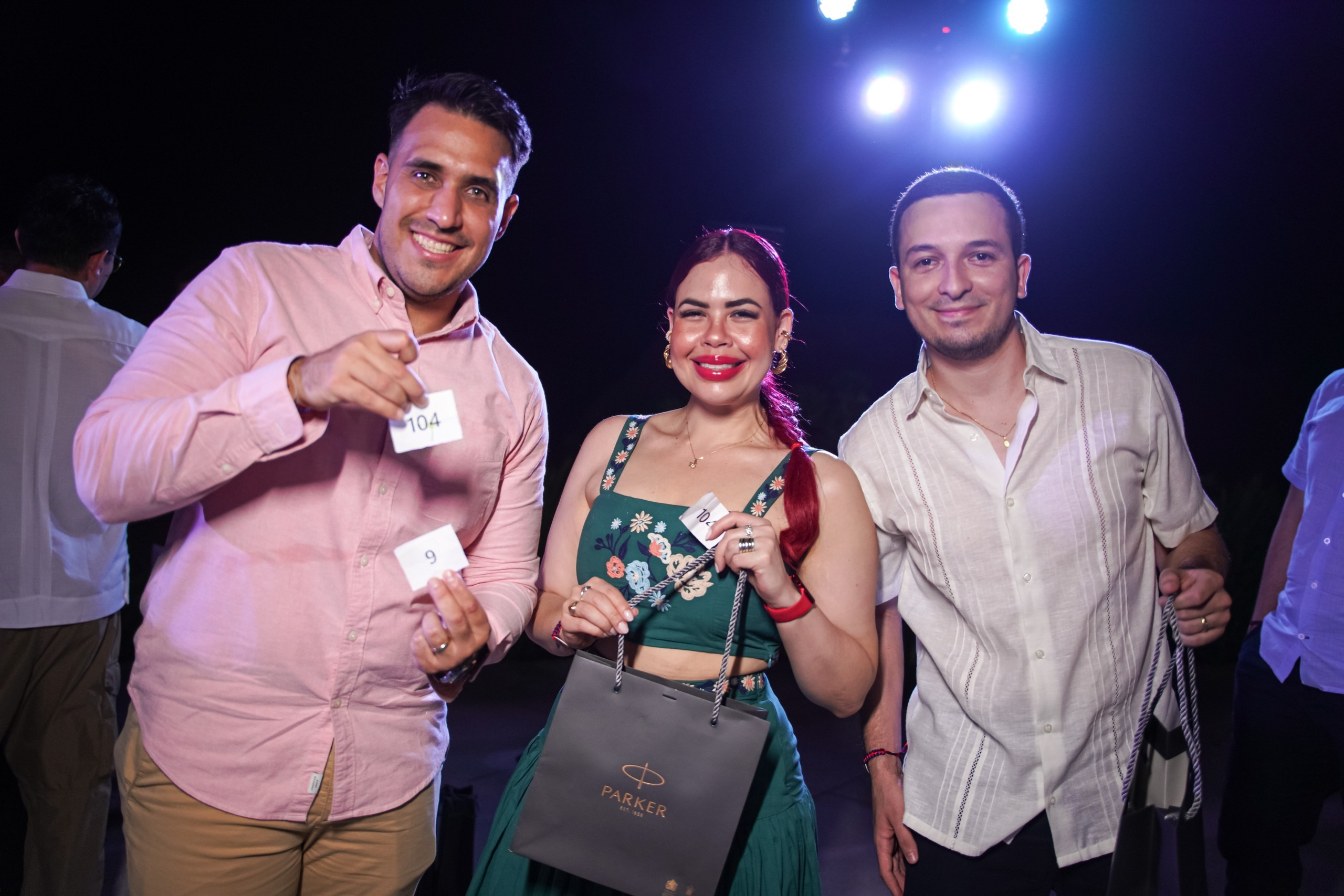 Award winners posing with prize after announcement.