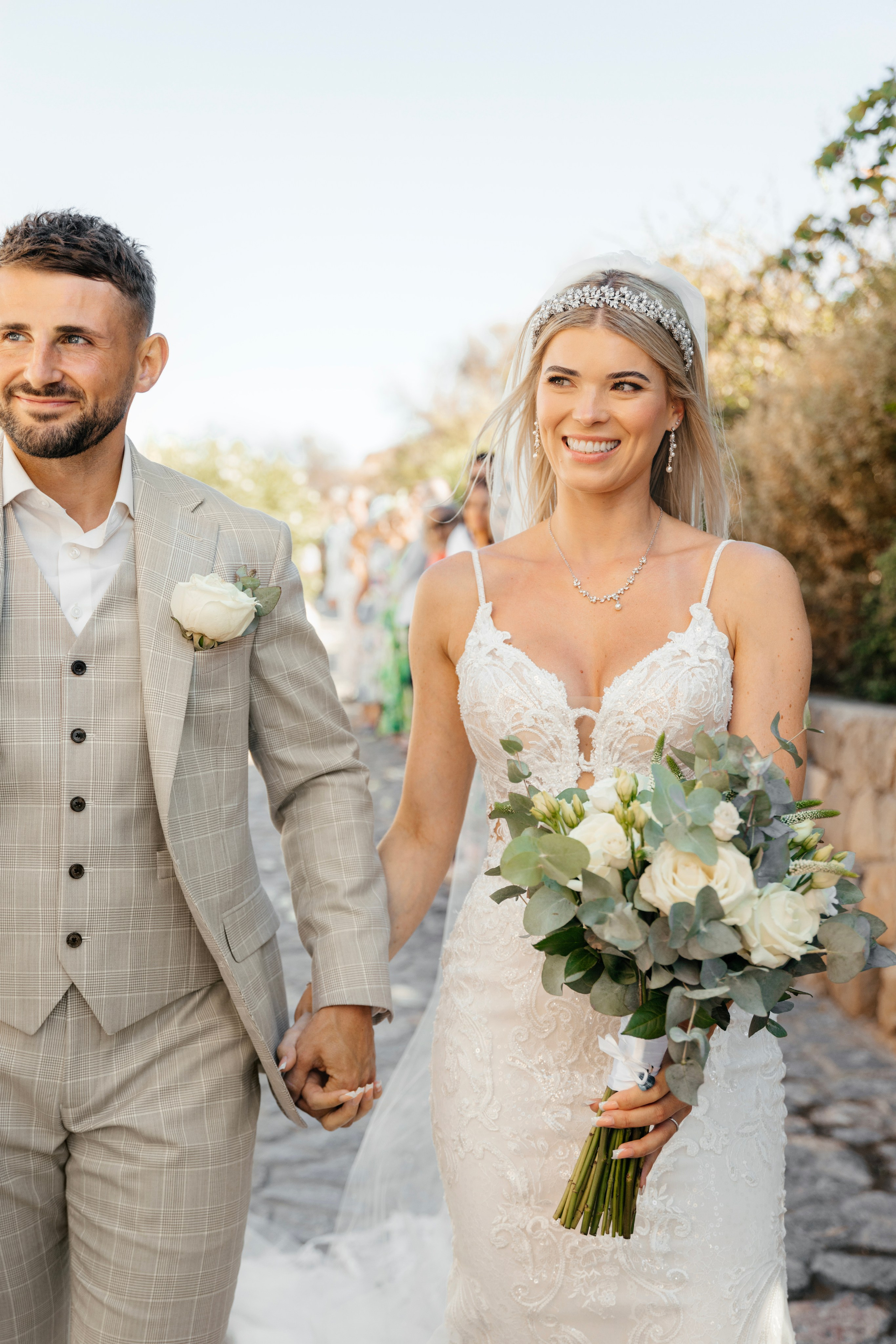 The couple is happy after the ceremony in Lindos, Rhodes, Greece