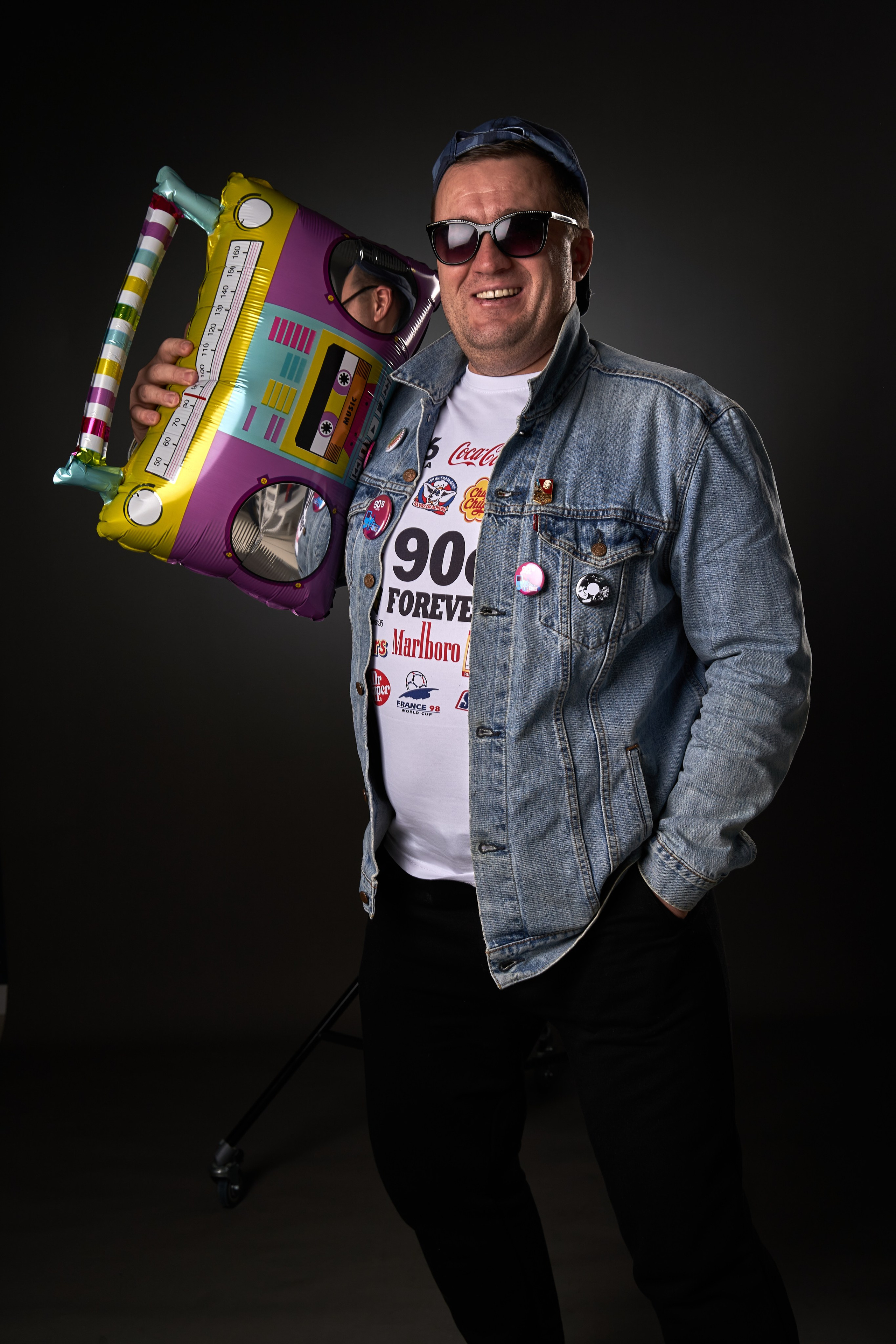 Studio photoshoot of a man in a retro look. Elegant and timeless imagery