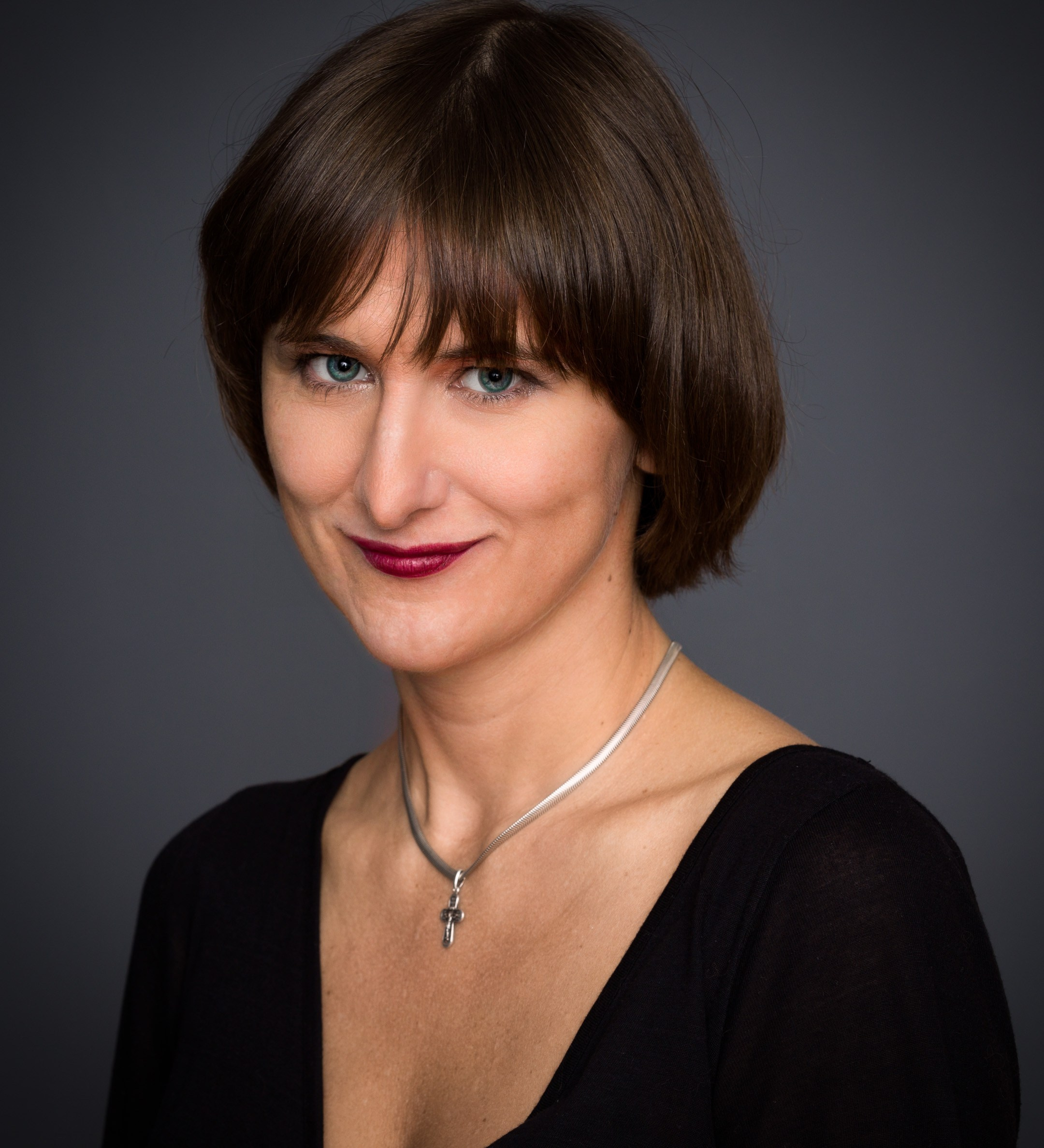 Portrait of a young lady on dark studio background - photographer Andrey Dunin