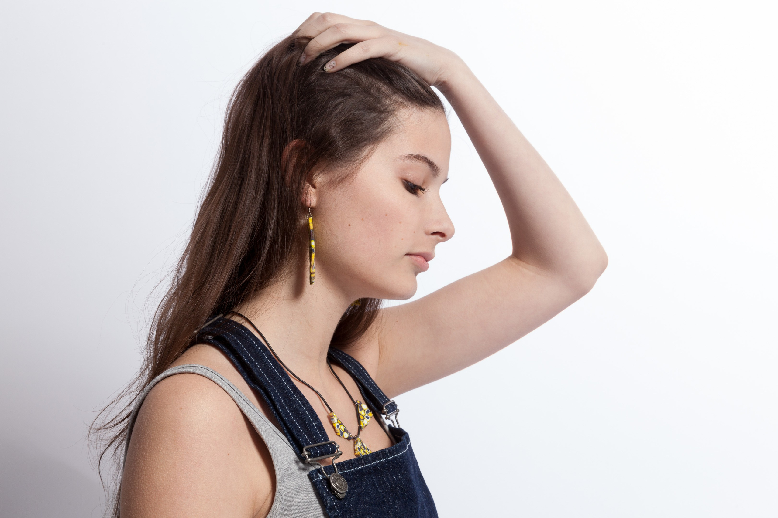 Portrait of a young girl on white studio background - photographer Andrey Dunin