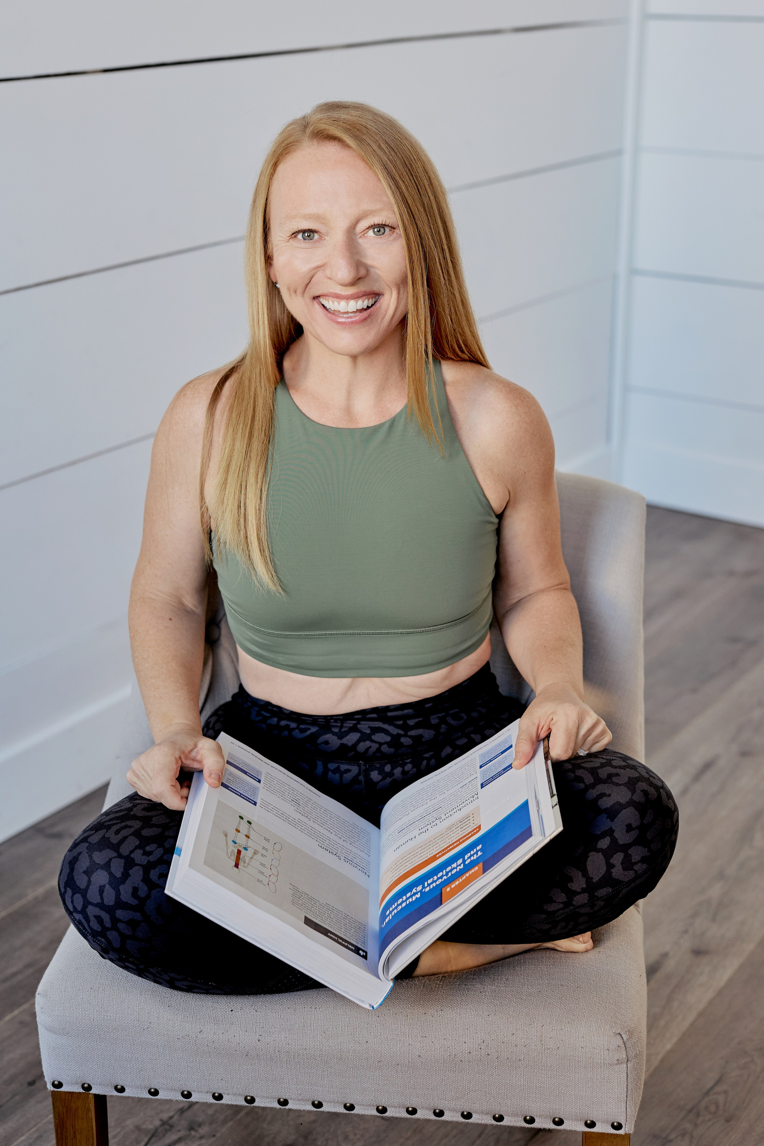 fit woman reading book about fitness