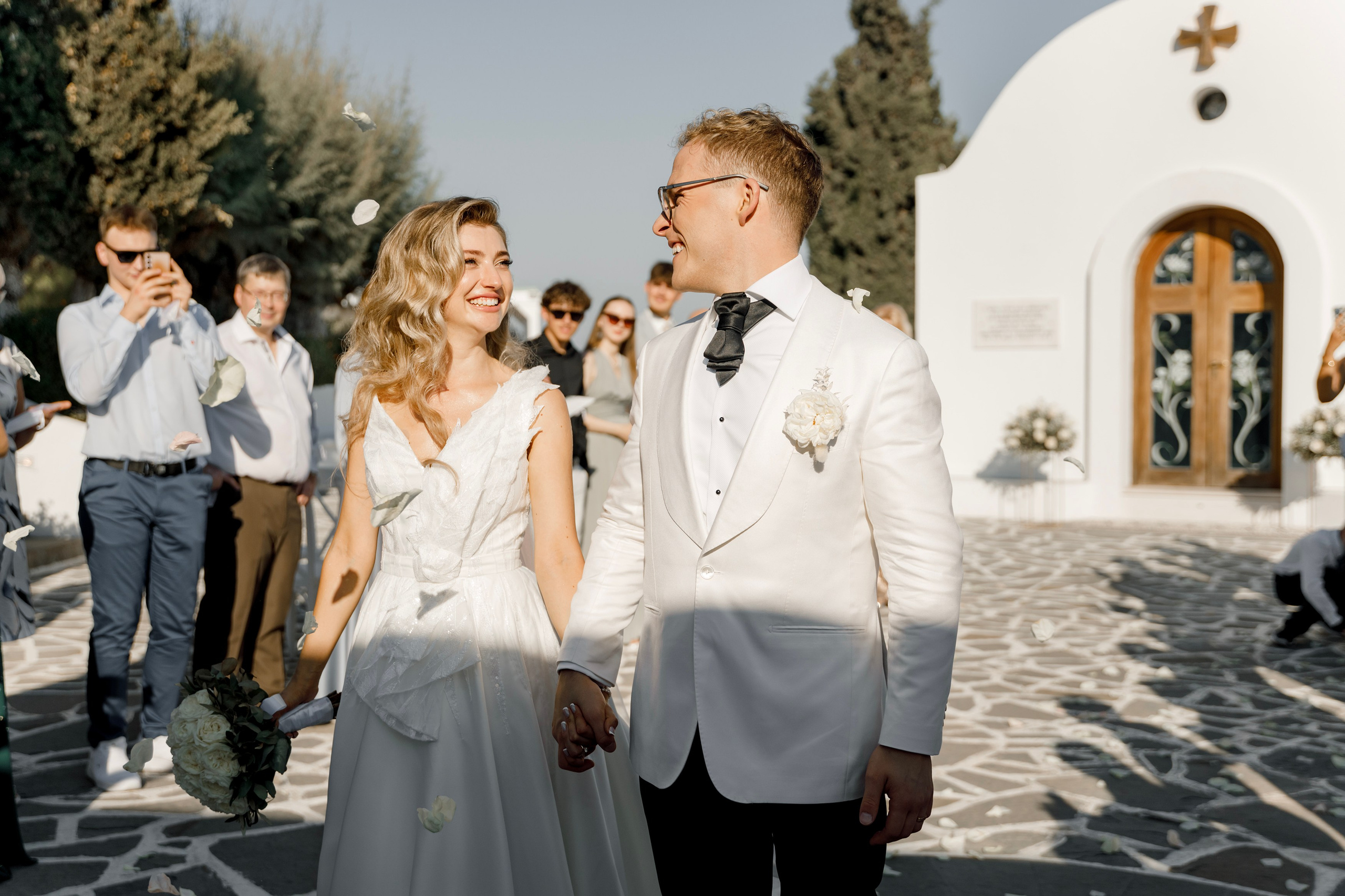 Groom and bride are happy after the ceremony in Church Agia Sofia in luxury hotel Esperos Village. Rhodes Greece
