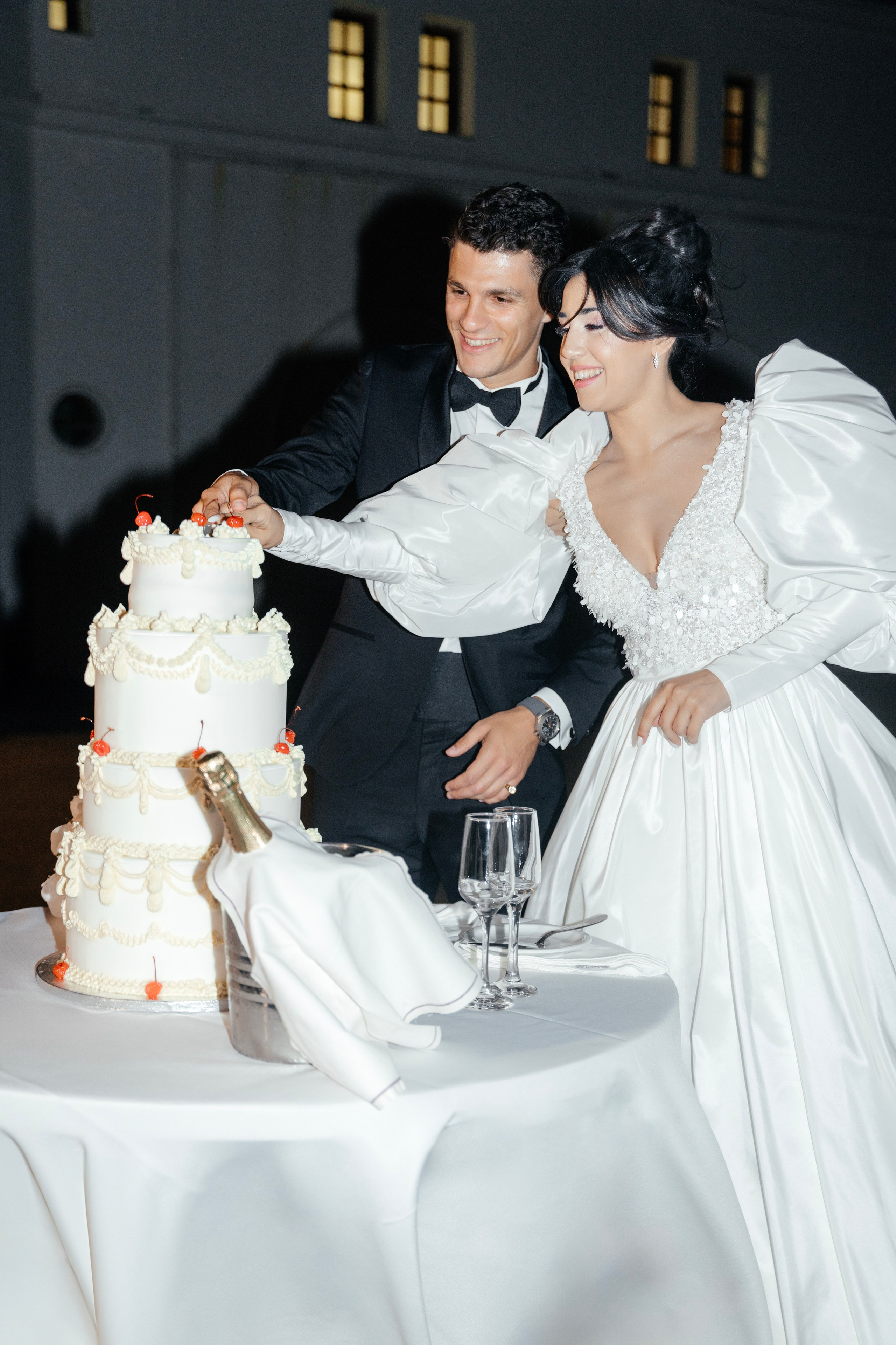 Bride and groom are cutting the wedding cake. Rhodes Greece