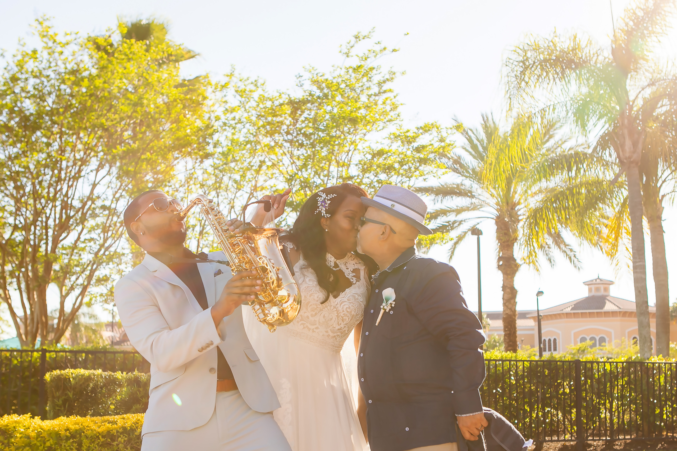 Bride & Groom and musician playing the saxophone