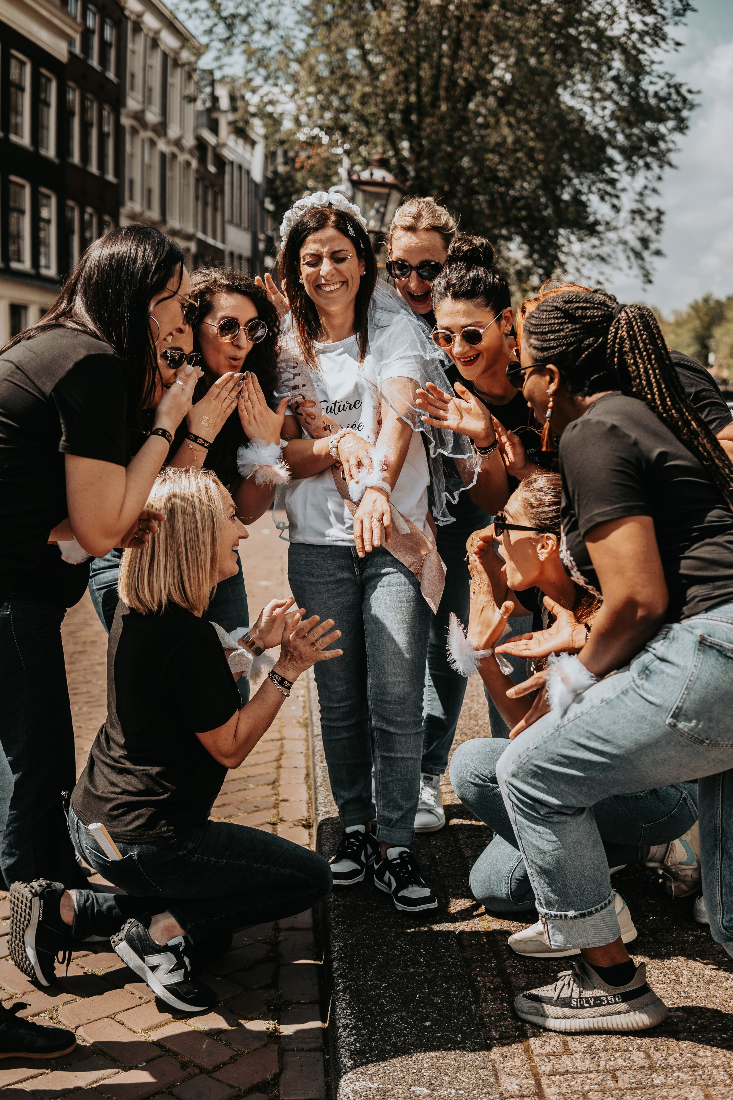 Girls surrounding the bride to be for a bachelortte party