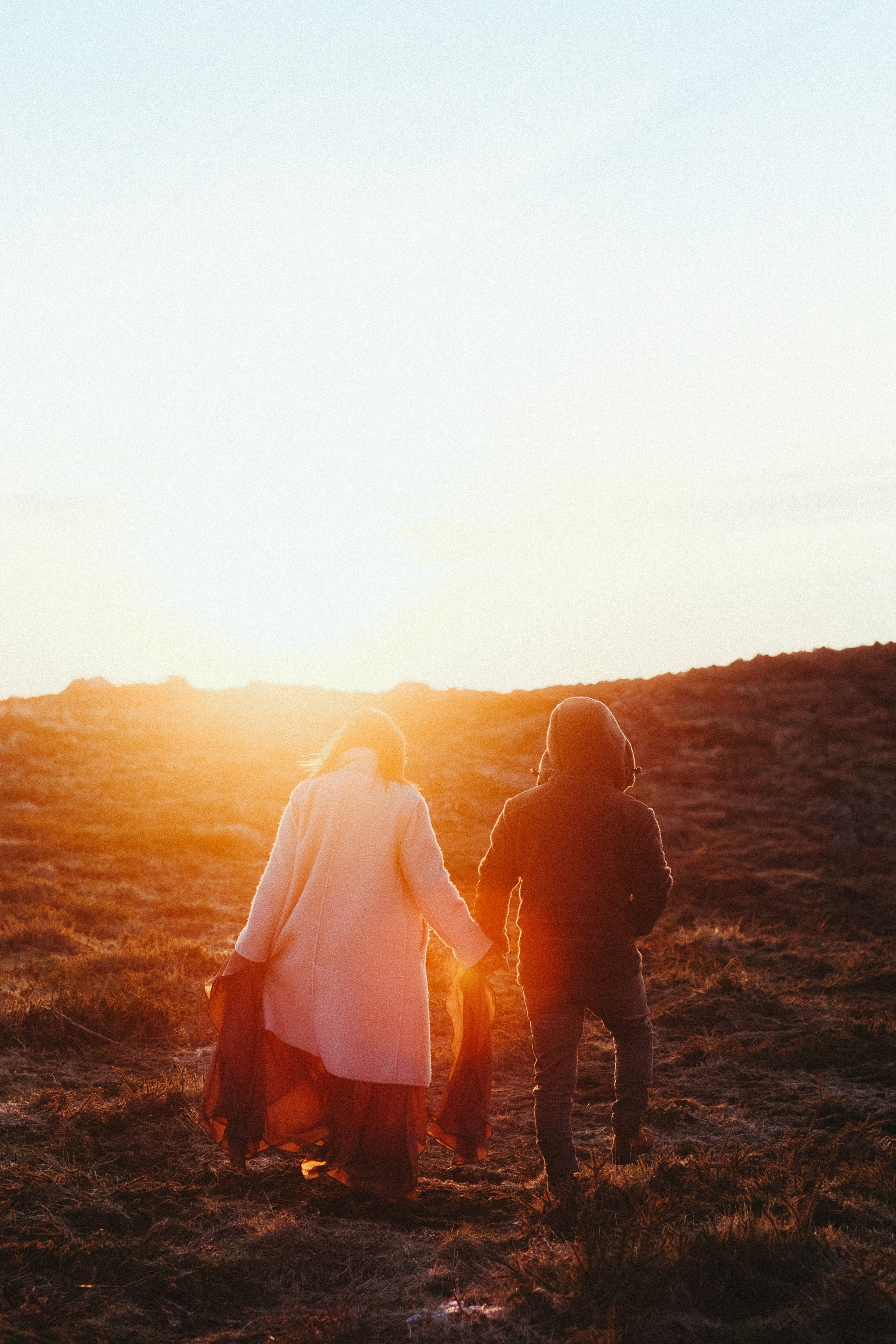 Couple walking through forest during engagement session in Portugal
