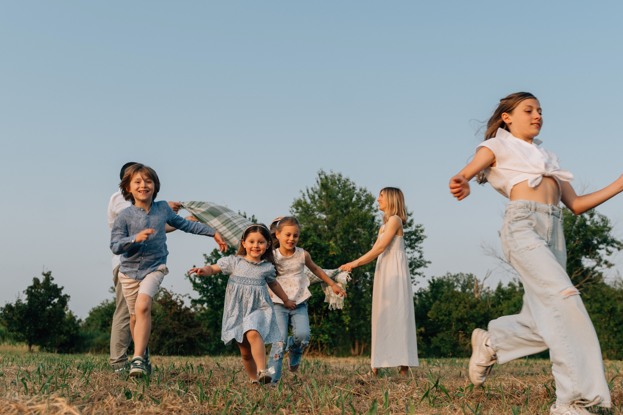 Servizio fotografico di famiglia in un parco a Rimini, Italia. Fotografa di matrimoni e di famiglia in Italia