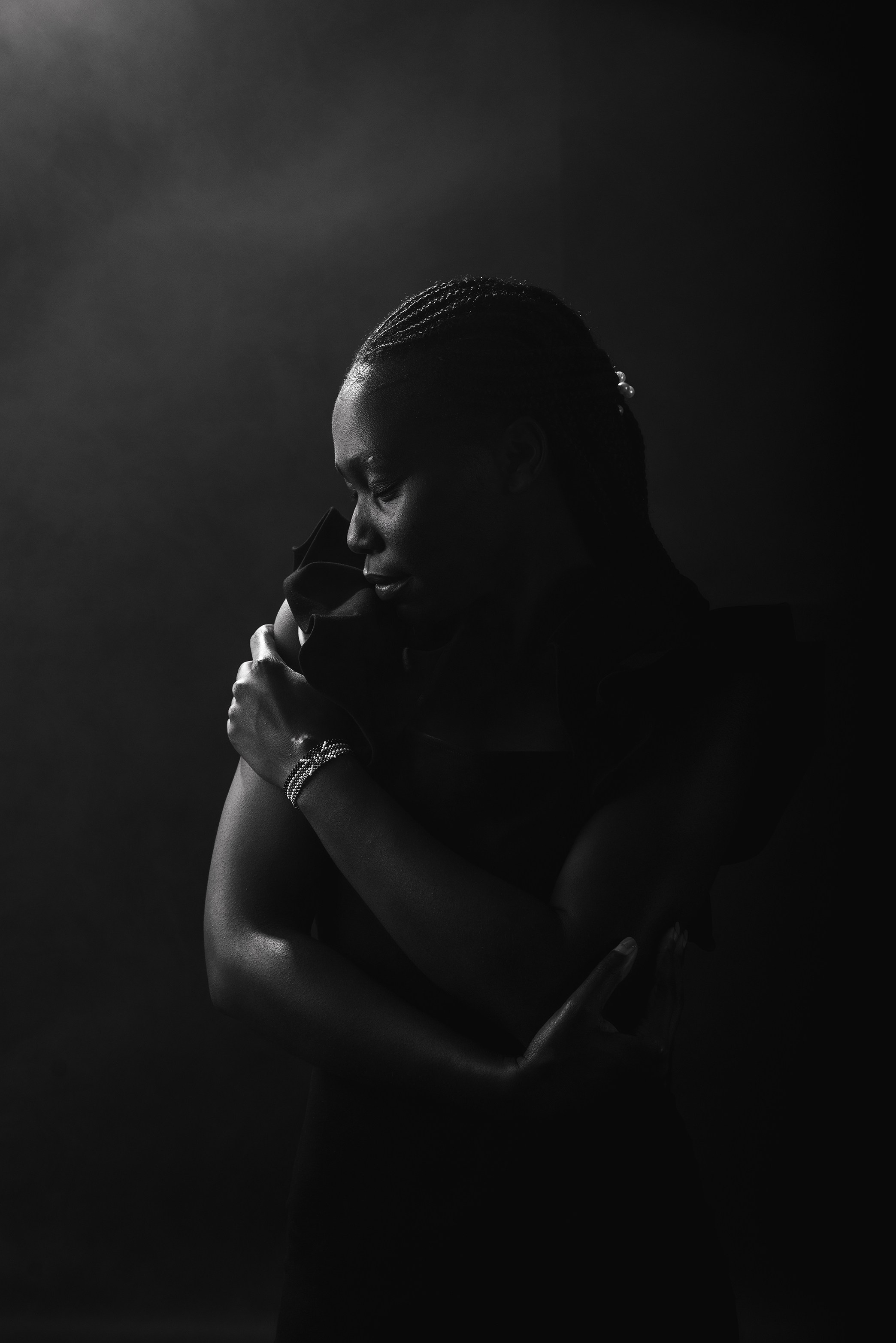 Cinematic black and white studio portrait.