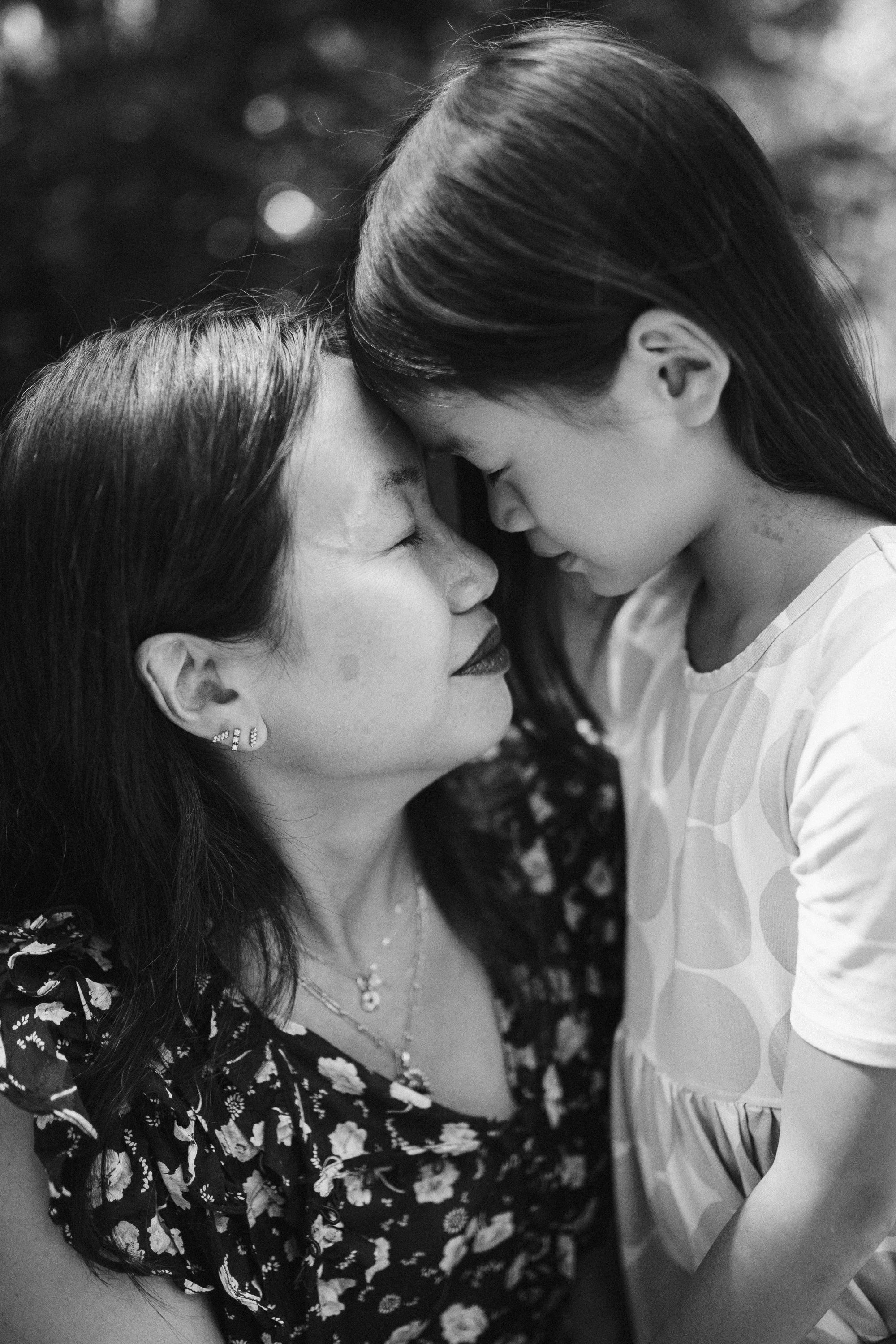 Mom and daughter together, black and white candid photo