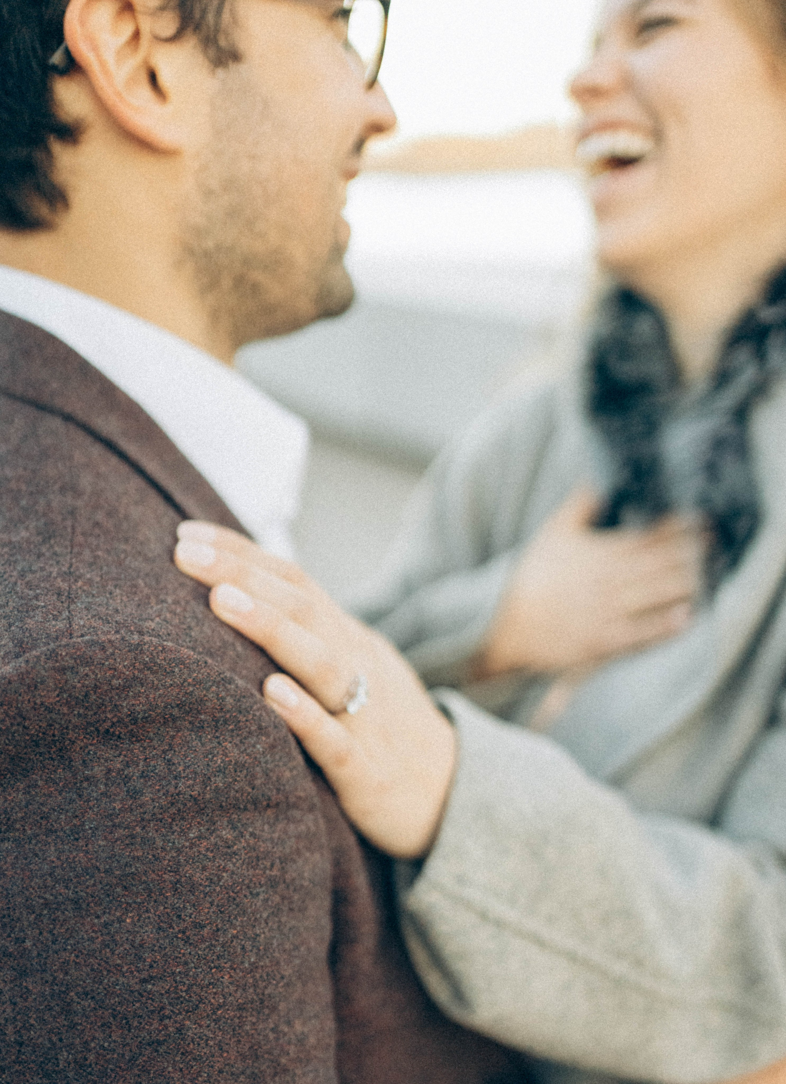 Couple celebrating engagement near Empire State Building.