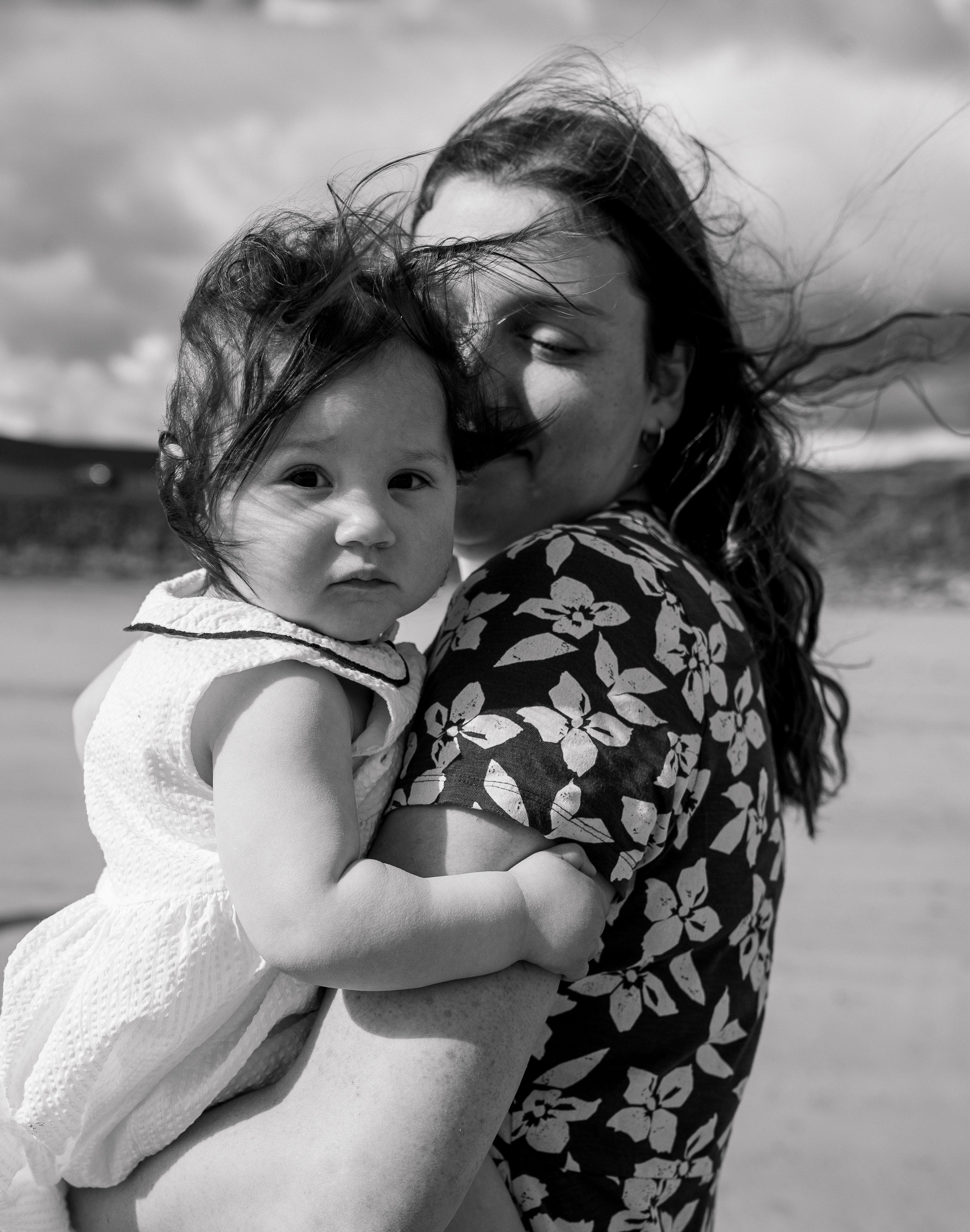 Darya and Mia at the ocean. Wedding and family photographer Ireland